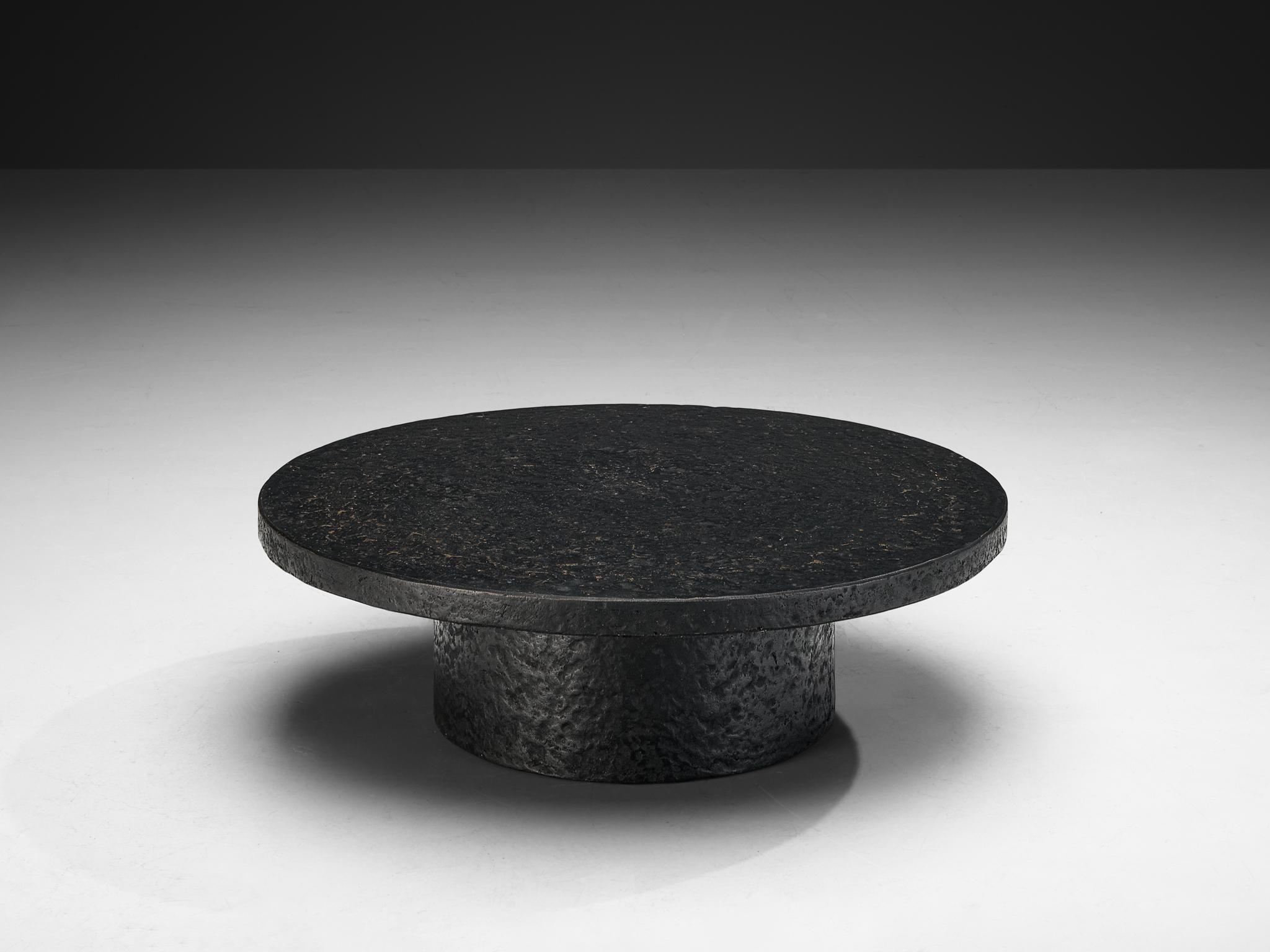 Cocktail or coffee table, resin, Northern-Europe, 1970s.

A striking example of 1970s design, this deep black coffee or cocktail table embodies a bold yet refined aesthetic. Crafted entirely from resin, the material mimics the rich texture and
