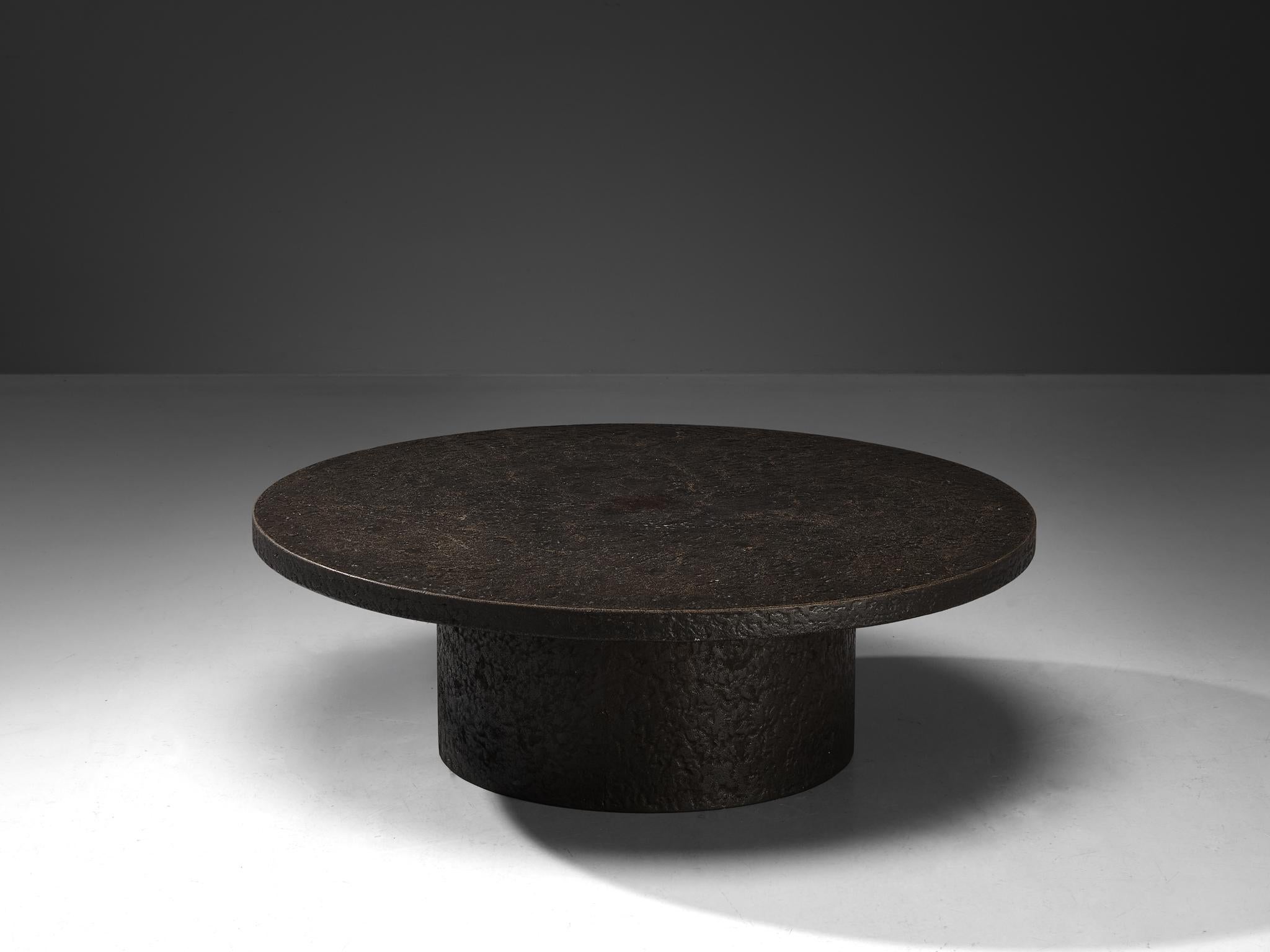 Cocktail or coffee table, resin, Northern-Europe, 1970s.

A striking example of 1970s design, this deep black coffee or cocktail table embodies a bold yet refined aesthetic. Crafted entirely from resin, the material mimics the rich texture and