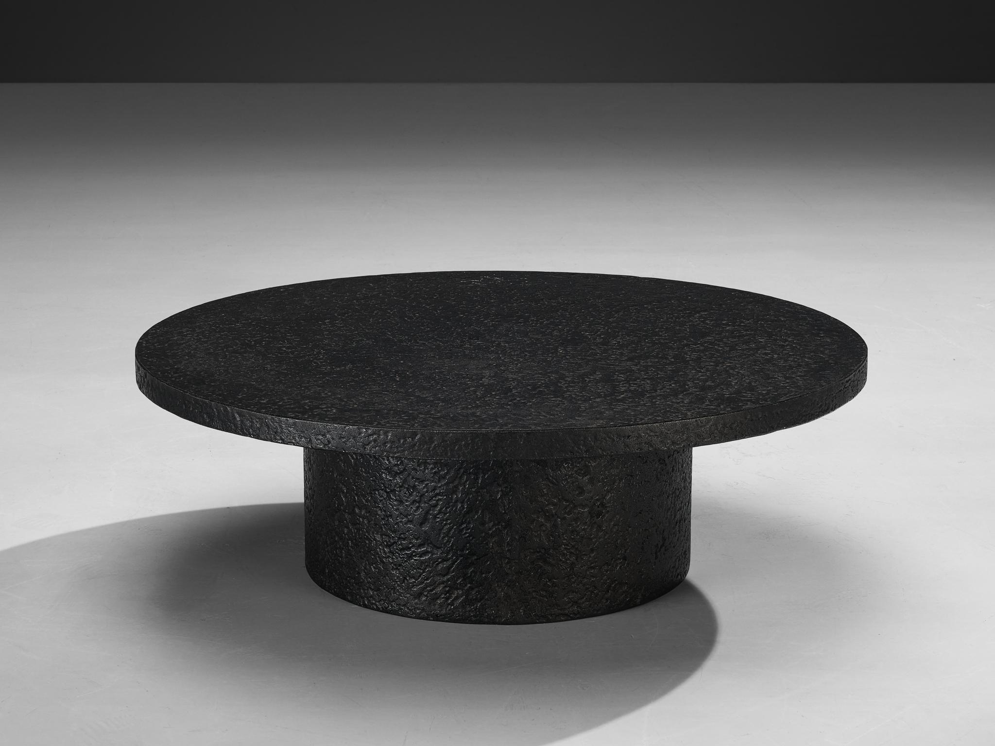 Cocktail or coffee table, resin, Northern-Europe, 1970s.

A striking example of 1970s design, this deep black coffee or cocktail table embodies a bold yet refined aesthetic. Crafted entirely from resin, the material mimics the rich texture and