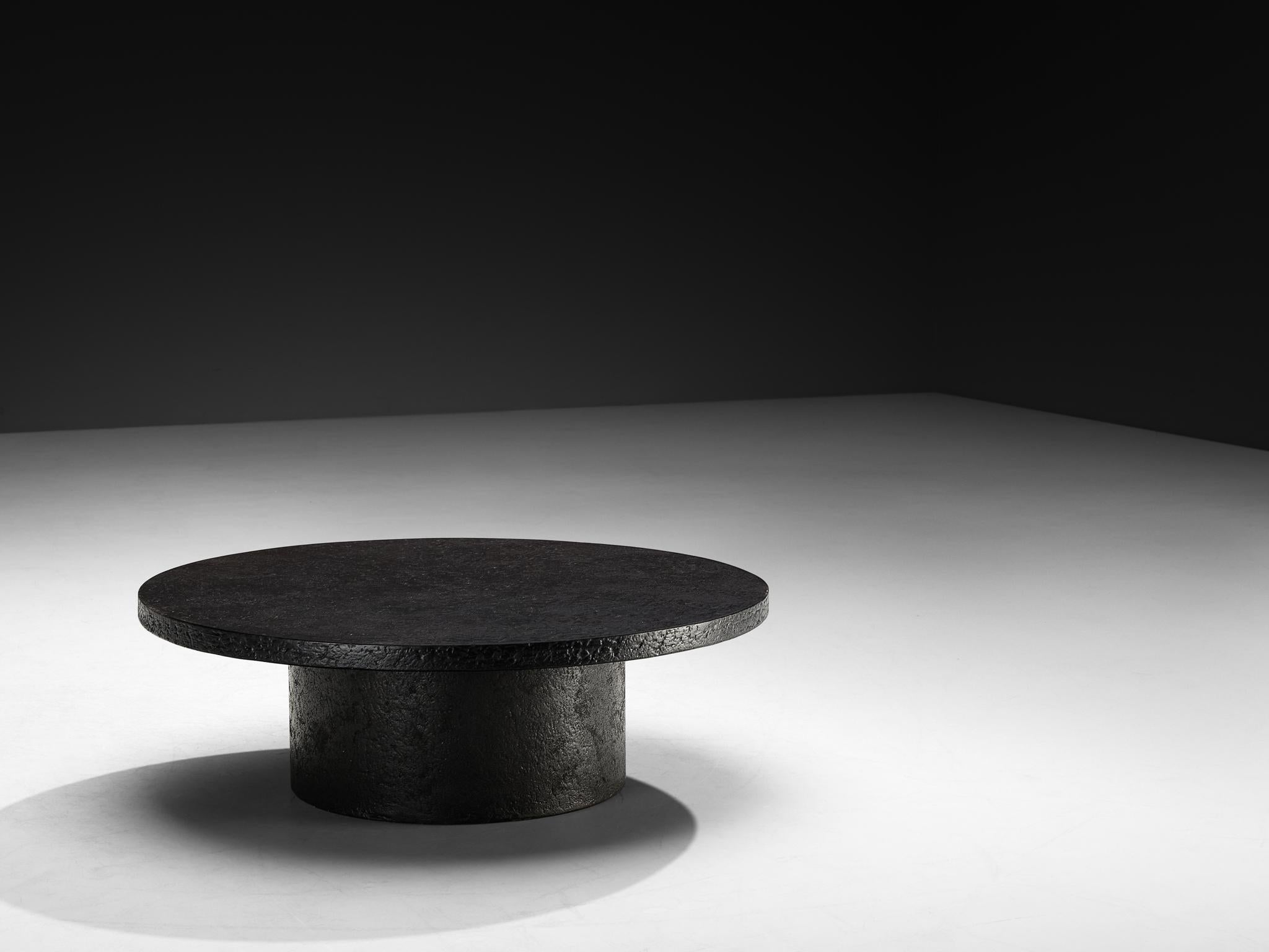Cocktail or coffee table, resin, Northern-Europe, 1970s.

A striking example of 1970s design, this deep black coffee or cocktail table embodies a bold yet refined aesthetic. Crafted entirely from resin, the material mimics the rich texture and