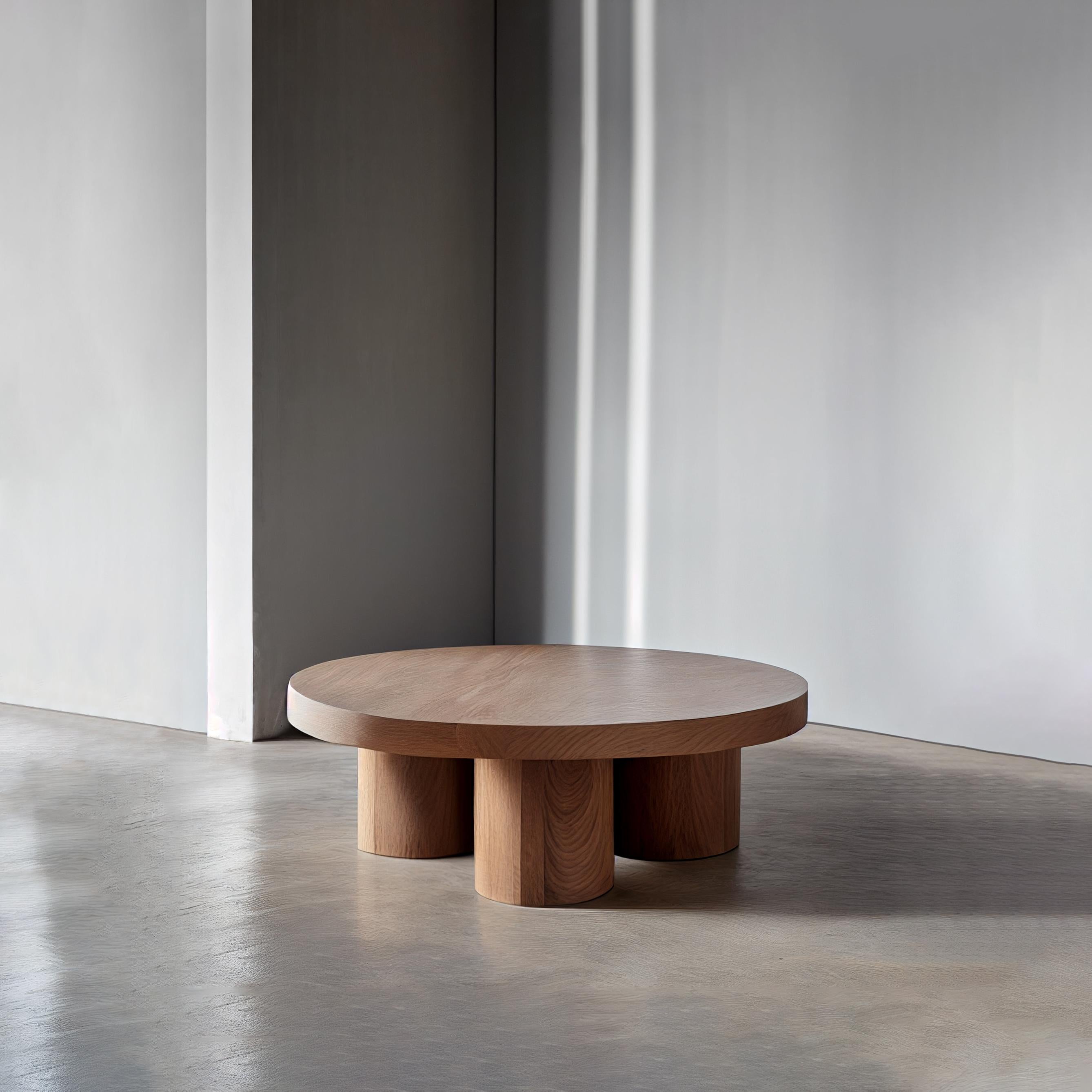 Brutalist round coffee table in red oak wood veneer, Podio by NONO

The NONO design team presents a coffee table that exudes elegance and modernity. The foundation of this piece is a cluster of cylindrical columns, providing a sturdy base for the