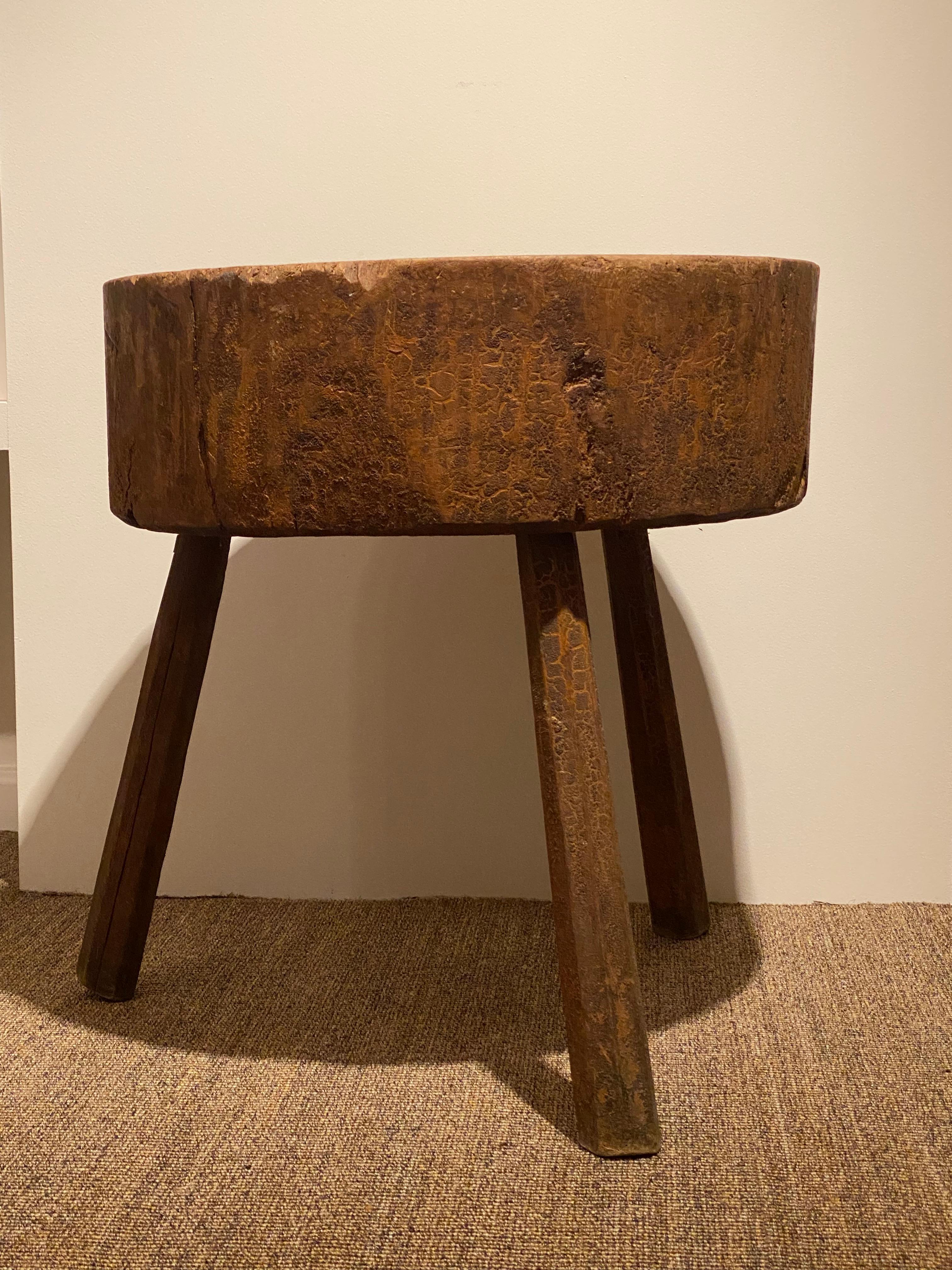 Antique , Brutalist Spanish Butchers Block made from Beech Wood,
a powerful Tripod table to be used for different purposes,
highly decorative piece of furniture,
great wear and patina of the wood