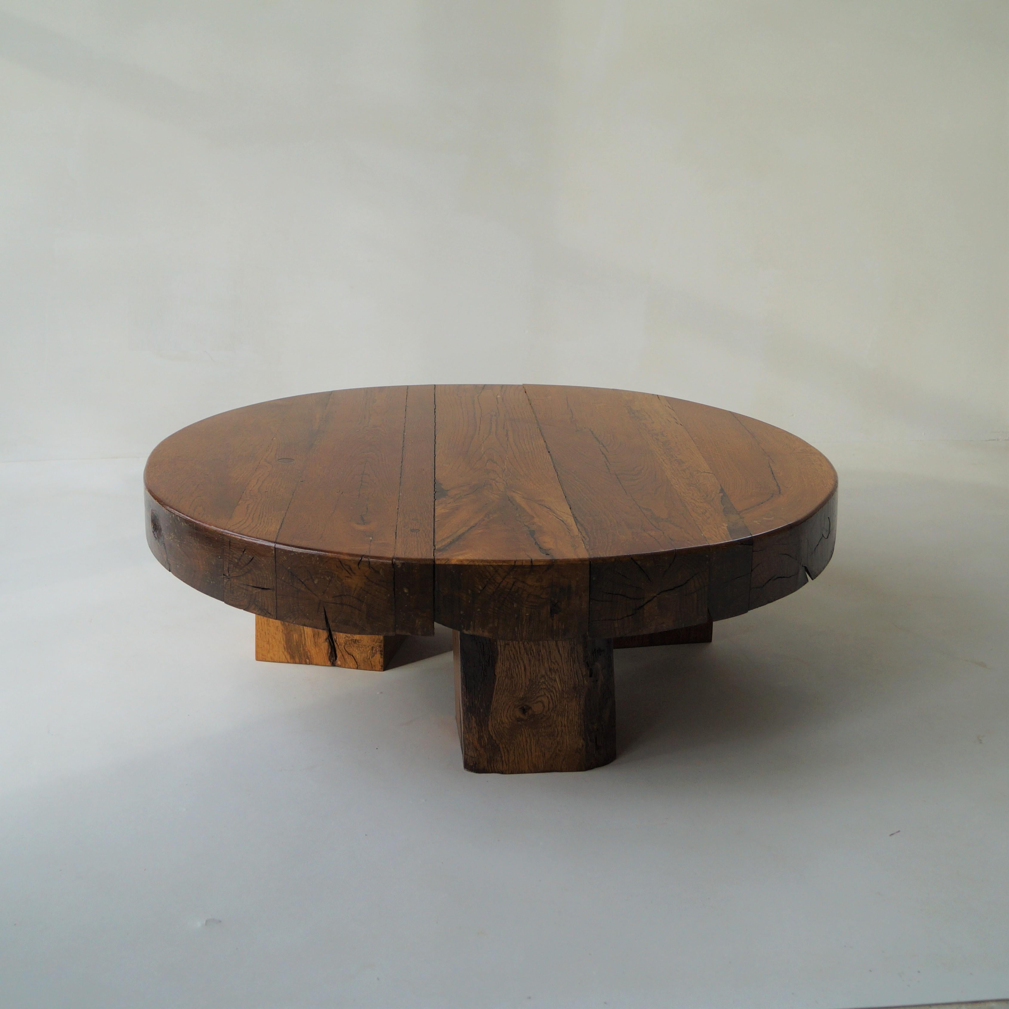 Dutch artisan 1970s solid wooden coffee table, with a thick wooden tabletop on three solid logs as table legs. Robust and organic design, in style of Charlotte Perriand and Pierre Chapo. Tabletop is more than 10 cm thick. The piece is in good