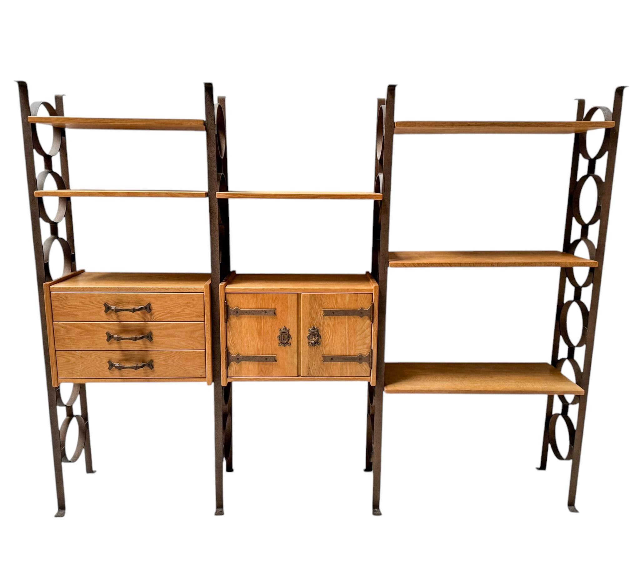 Decorative and rare Brutalist Rustic Mid-Century Modern freestanding modular wall unit.
Striking Dutch design from the 1980s.
Solid oak cabinets and shelves with wrought iron uprights, hinges and handles.
This wonderful Brutalist Rustic Mid-Century