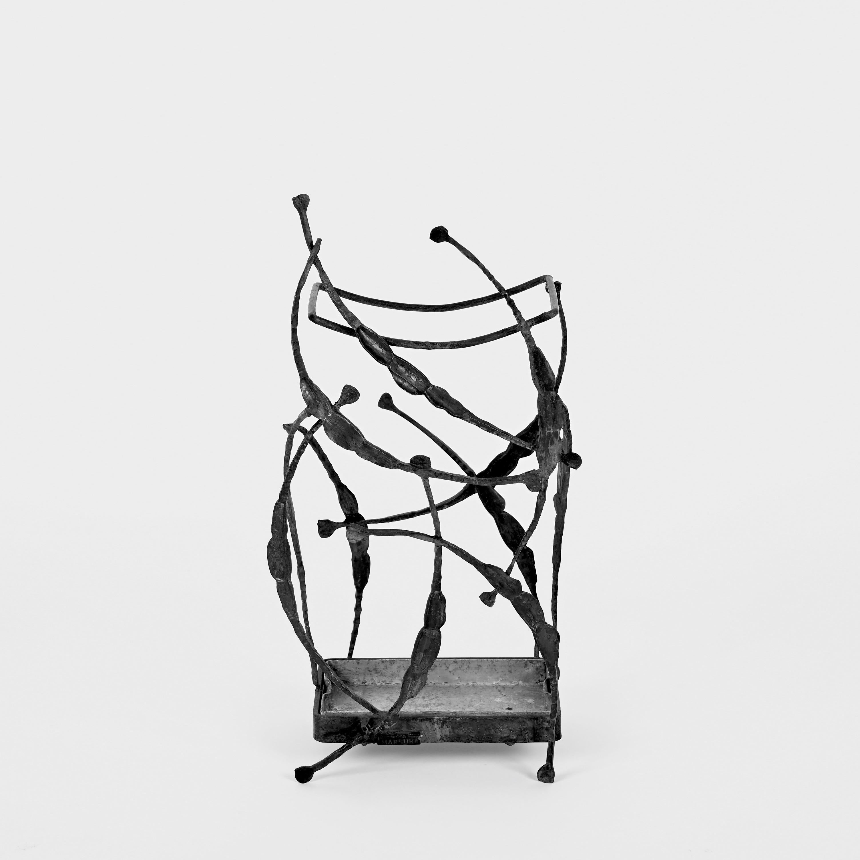 Fantastic midcentury brutalist hand-wrought-iron umbrella stand. Salvino Marsura designed this fantastic piece during the 1960s in Italy.

This item is a one-of-a-kind sculptural umbrella stand as it has been designed and handmade in wrought iron by