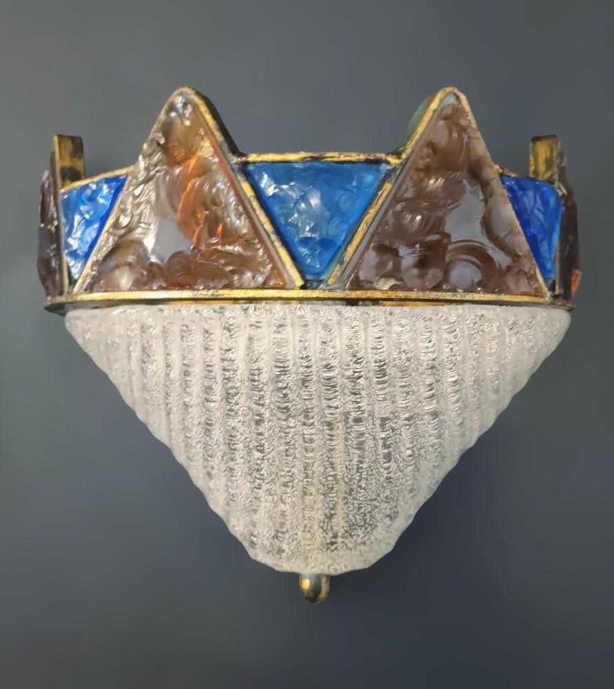 Vintage Italian brutalist Murano glass wall light with amber and blue triangular hand torn glasses and a clear granular diffuser  / made in Italy by Marino Poccetti circa 1960s
Measures: Height 9.5 inches, width 11 inches, depth 5 inches
1 light /