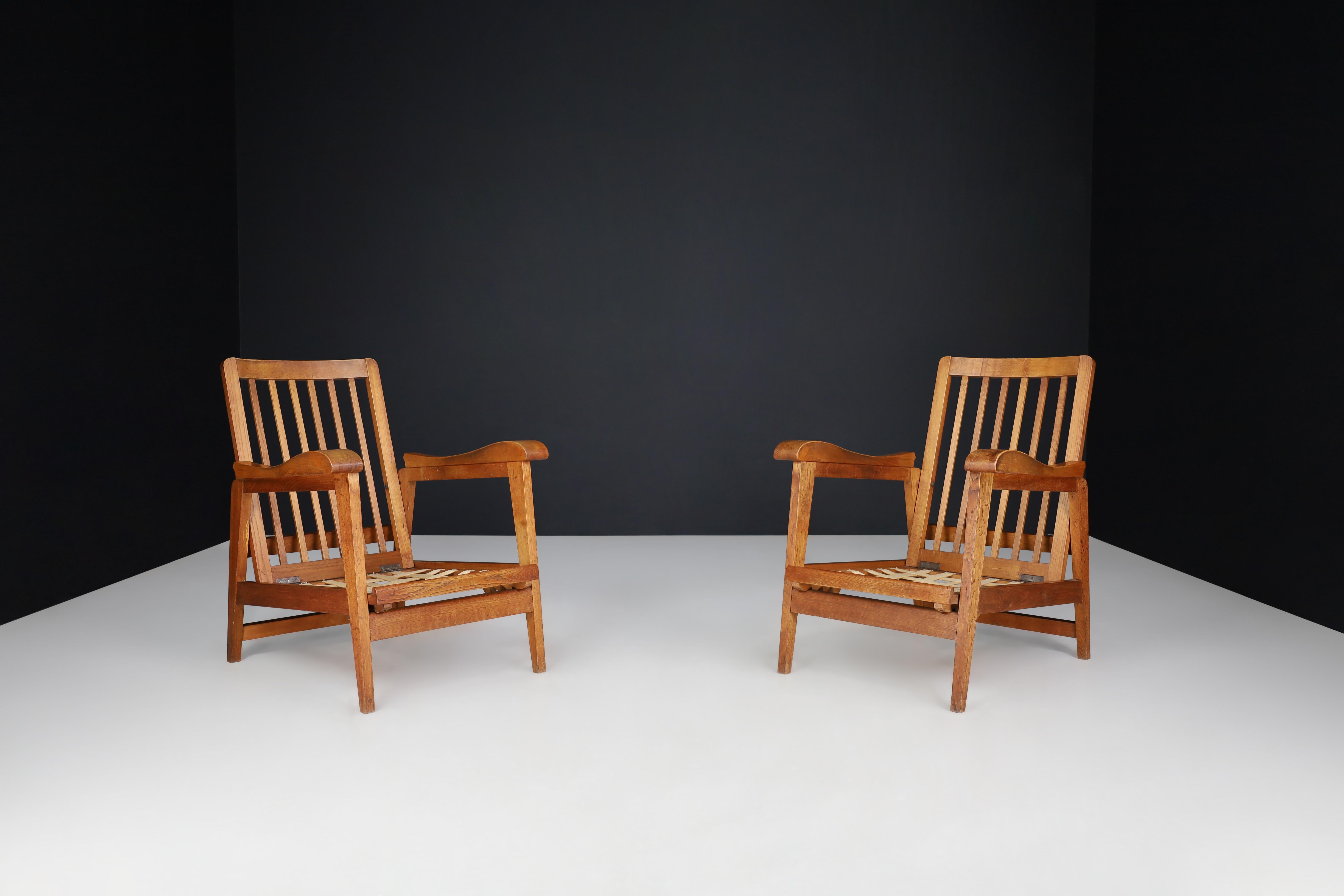 Brutalist Sculptural Adjustable Lounge Chairs in Oak set of 2 , France, 1950s

Here is a description of a pair of two original midcentury sculptural adjustable armchairs that were manufactured and designed in France in the 1950s. These armchairs are