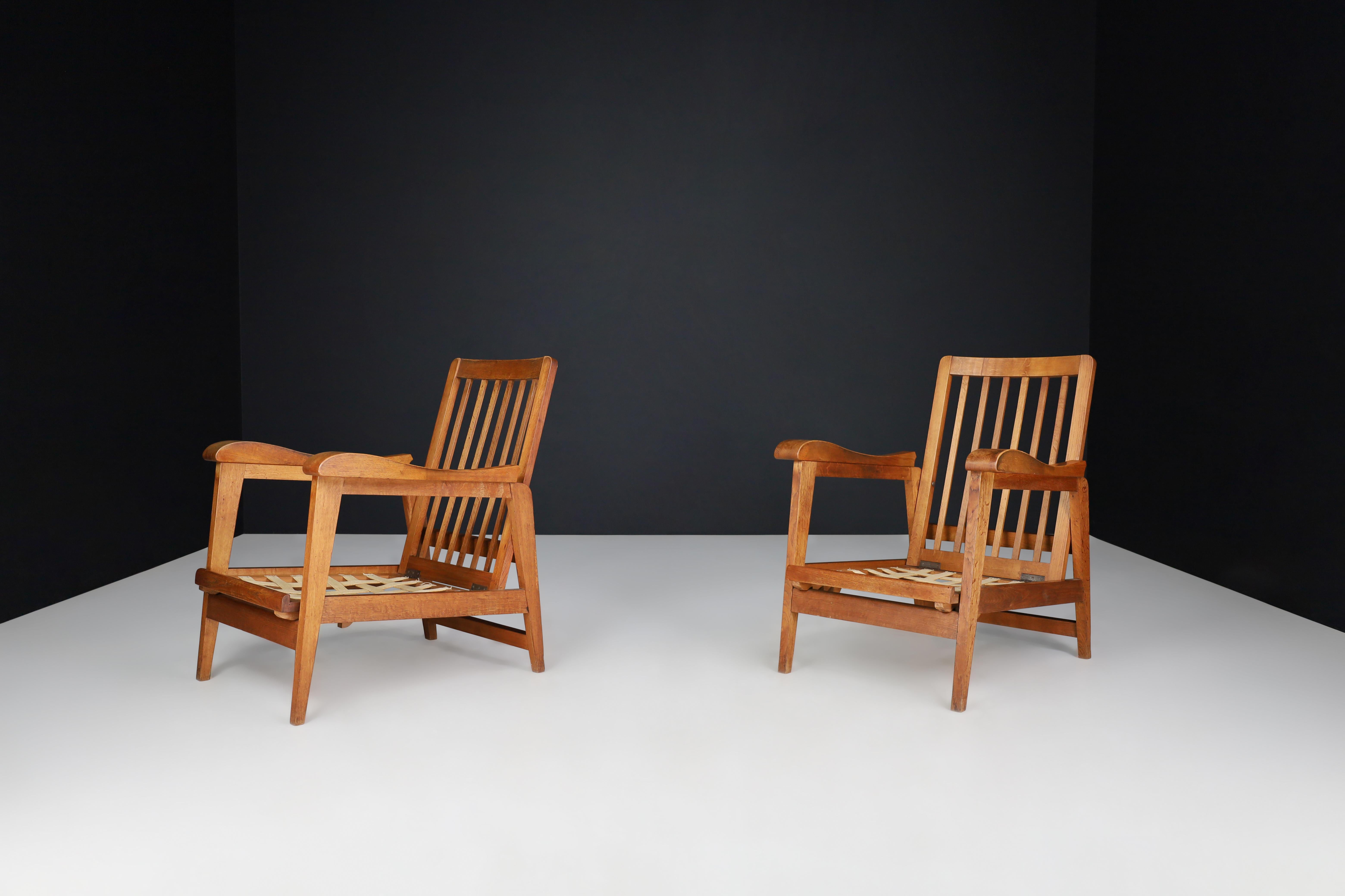 20th Century Brutalist Sculptural Adjustable Lounge Chairs in Oak set of 2 , France, 1950s For Sale