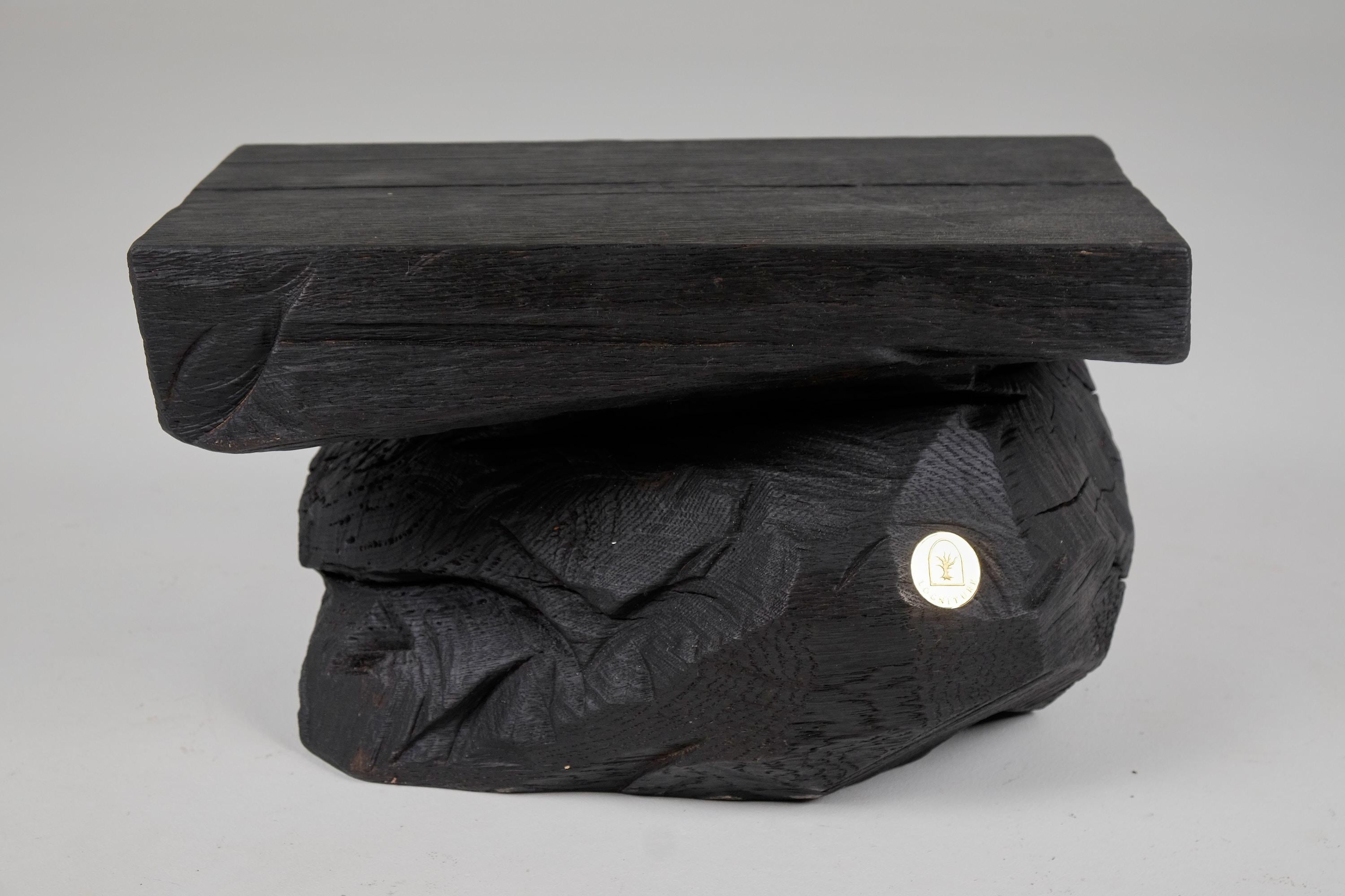 Chainsaw carved stool/side table. Carved from a single piece of burnt oak wood and protected with the highest quality oils, ensuring durability for generations. Such unique handmade design will highlight your interior and bring comfort to your home,