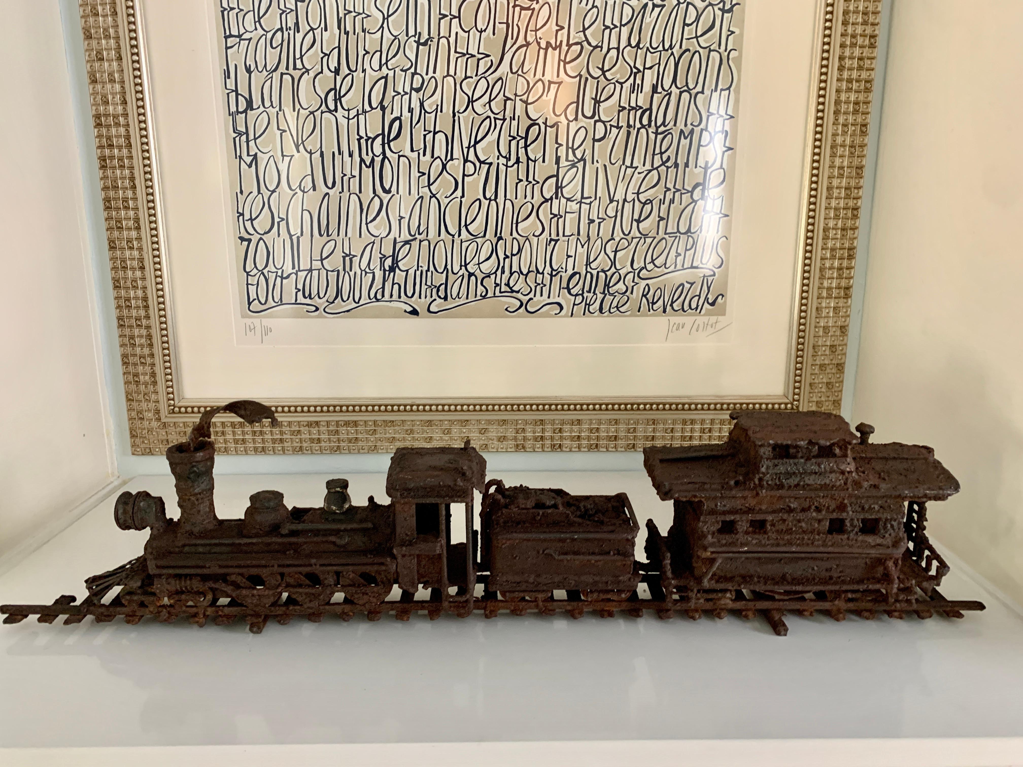 A wonderful and Heavily Patinated, very large example of Brutalist art of a train on a track. The entire piece is a solid unit, very stable and also quite heavy.  In the manner of Jere