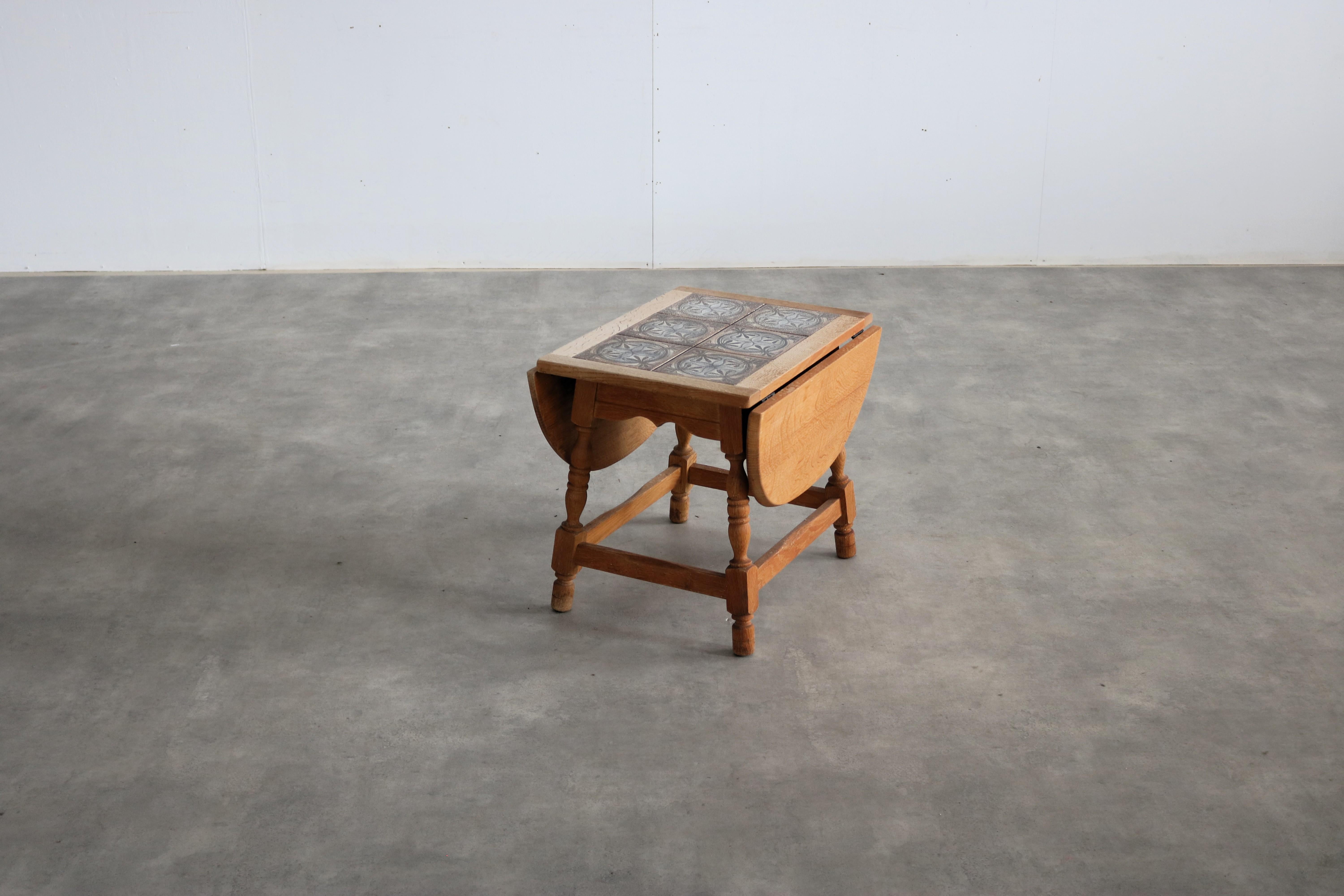 Brutalist side table  small table  1960s  Danish

period  1960s
design  style Henning Kjaernulf  Denmark
condition  good  minor signs of wear
size  48 x 39.5 x 54 (h x w x d) + 2x 23,5 table top; 

details  oak; ceramic;

item number  2944