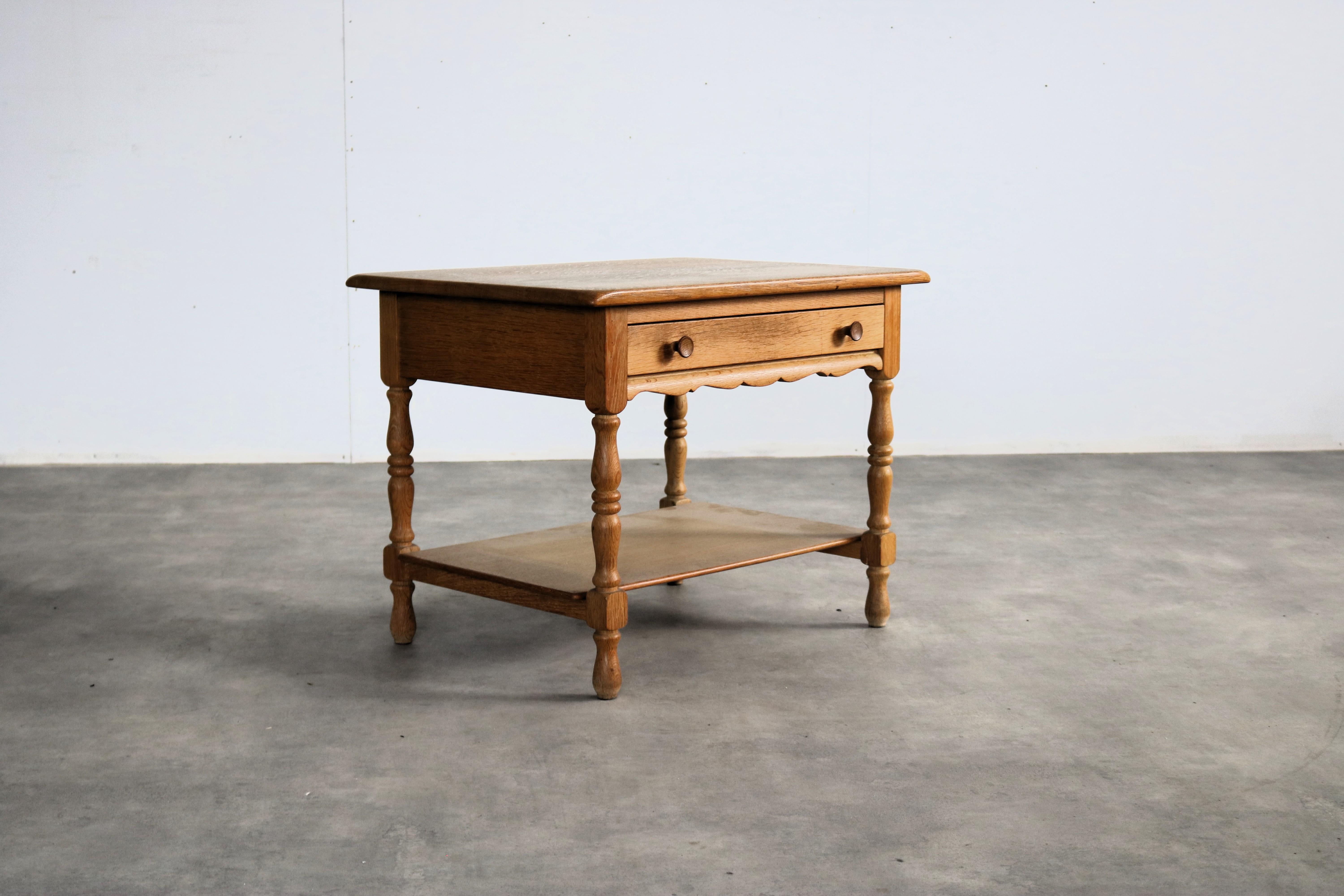 Brutalist side table with drawer  chest of drawers  1960s  Danish

period  1960s
design  style Henning Kjaernulf  Denmark
condition  good  minor signs of wear
size  54 x 70 x 51 cm (H x W x D)

details  oak;

item number  2947