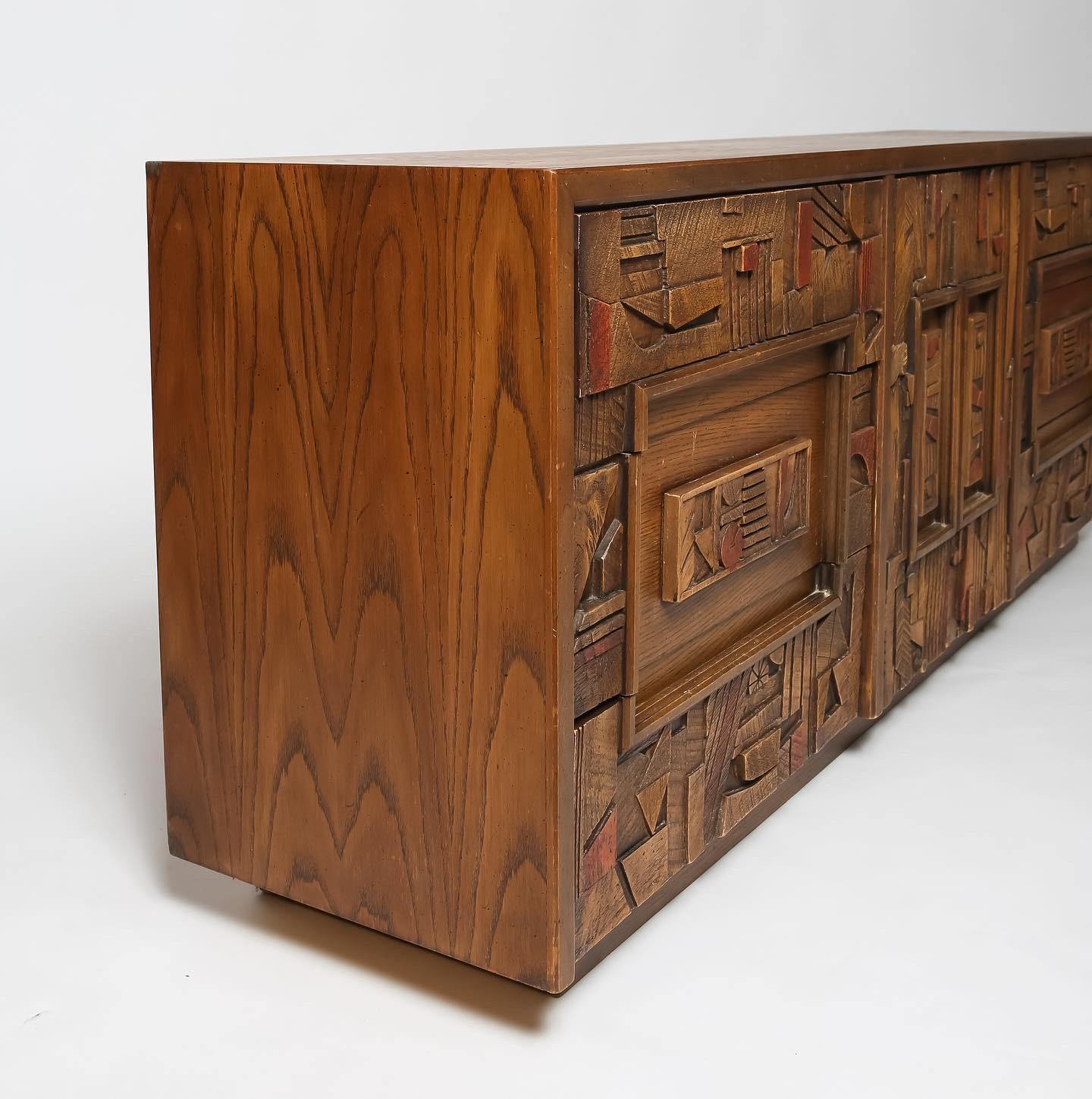 Brutalist 9-drawer dresser from the “Pueblo” line by Lane. Constructed of stained oak with fantastic resin relief panels aligned at drawer fronts creating a statement piece suitable for a variety of spaces. In very good vintage condition. Lots of