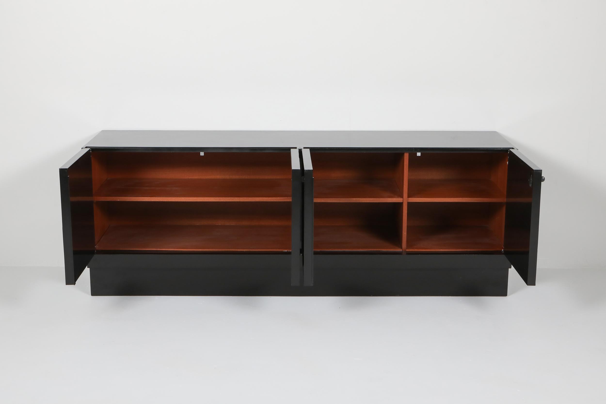 Diamond stained oak Brutalist credenza, De Coene Belgium, 1970s

Unusual model as this is glossy lacquered and rests on a solid base.
Equipped with four door panels that show high quality woodwork with beautiful graphic shaped patterns.