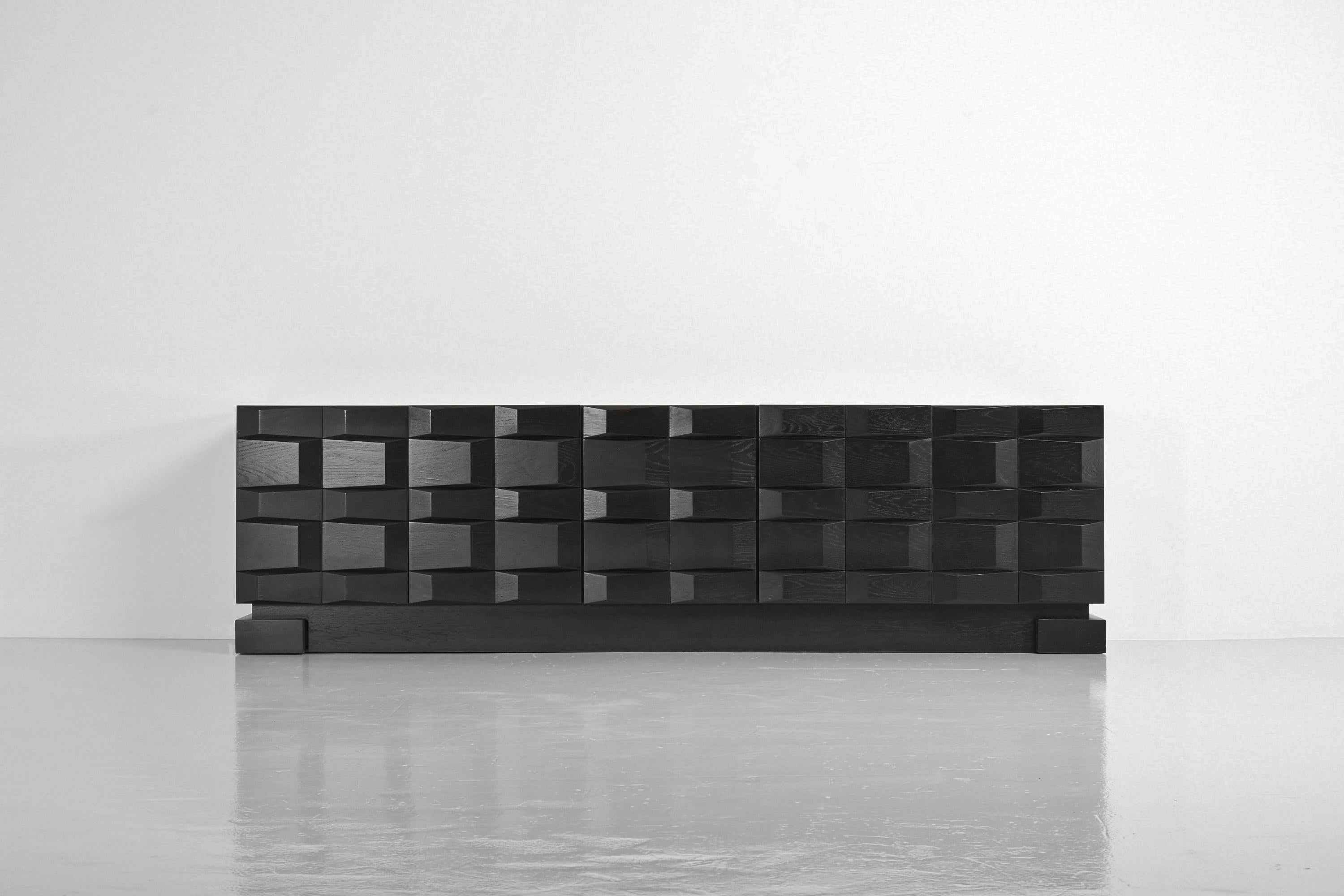 Beautiful brutalist shaped sideboard/credenza with graphic panelled doors, made in Belgium 1970s. In the 1970s some Belgian factories and little cabinet makers produced these brutalist shaped cabinets and sideboards. Most of them with graphical
