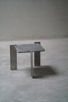 Brutalist sidetable in steel - by CONCREET.