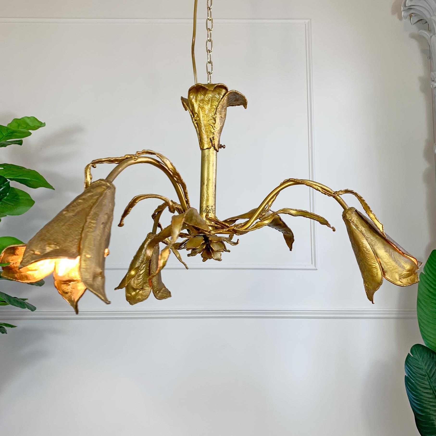 An extremely rare and large ceiling light, three beautifully proportioned lily flowers represent the bulb holders, the light resplendent in Moerenhout’s signature Brutalist style, the large central stem with twisting leaf design and a central flower
