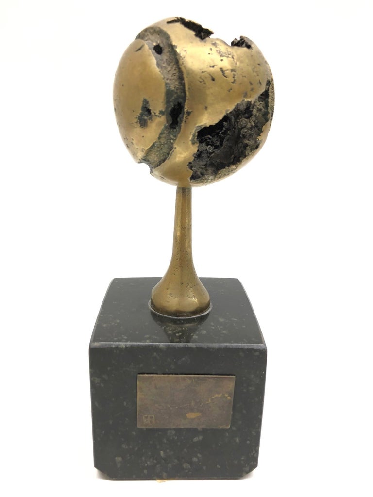 A beautiful substantial and stunning Brutalist sculpture cast in bronze with a powerful sense of movement. The circa 1970s work is presented upon a black marble base and is signed to one side. The artist has incorporated both textured finishes which