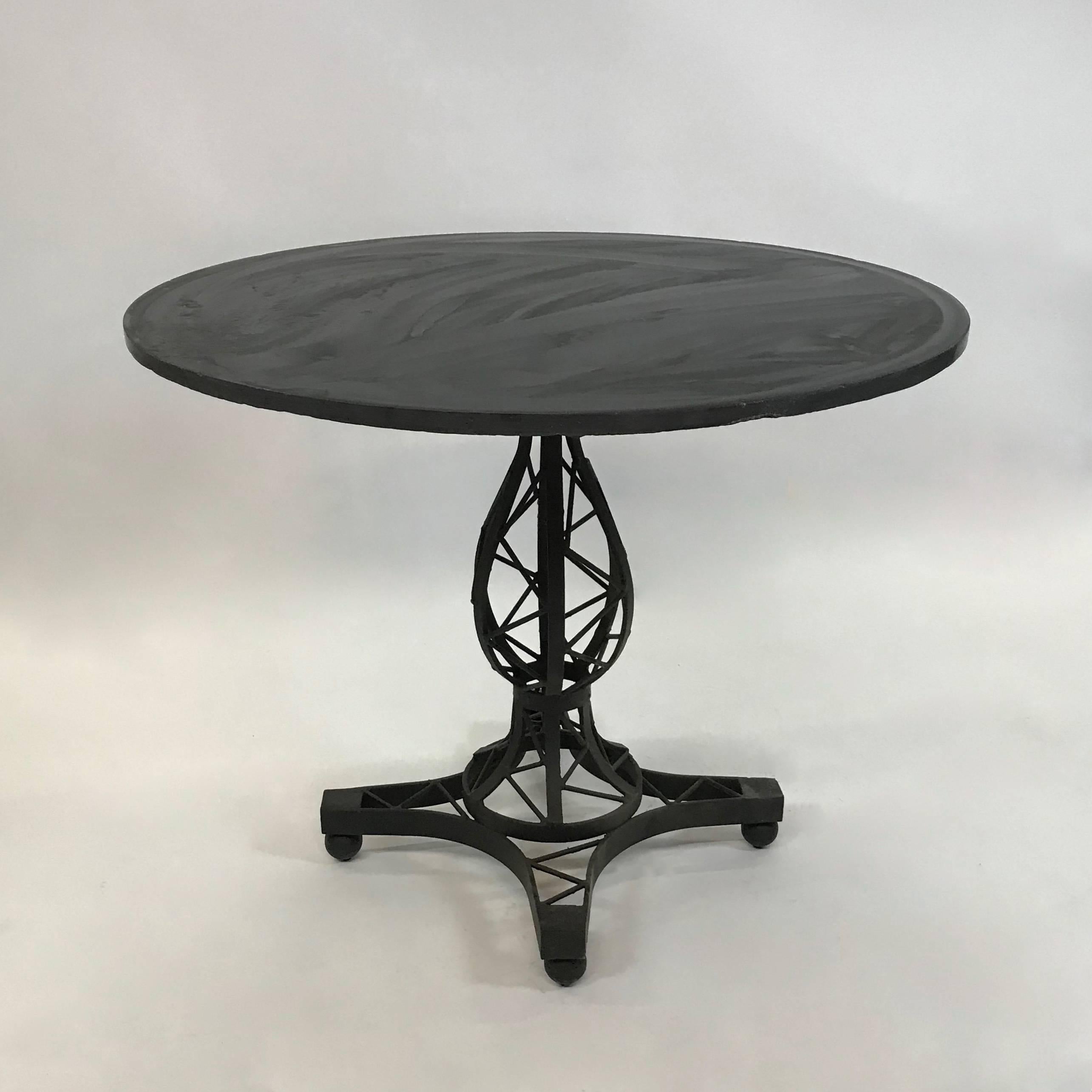 Midcentury, café, bistro, dining table features a 36 inch round black slate top with unusual, woven wrought iron, Brutalist, pedestal base.