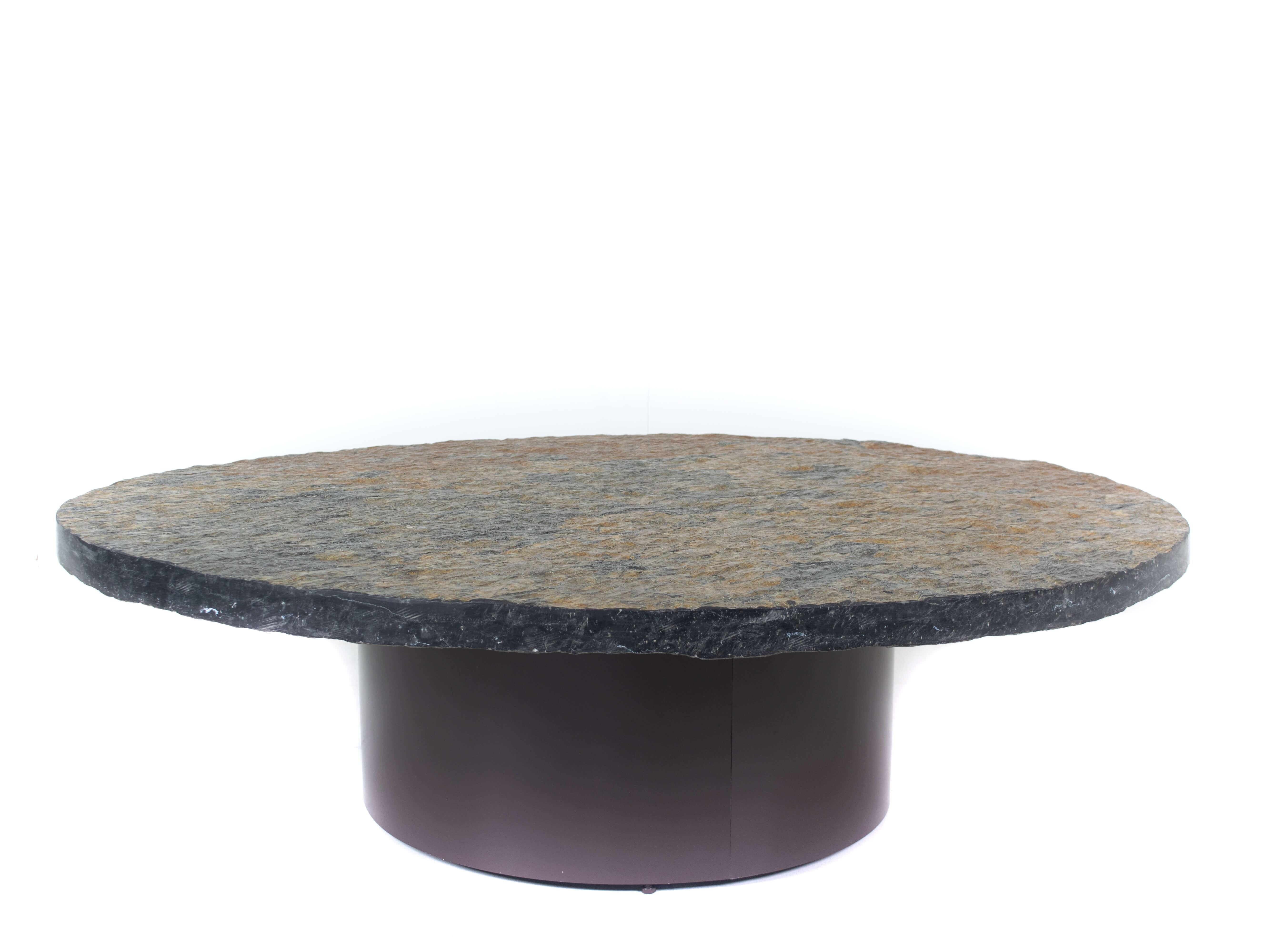 Impressive Brutalist Slate vintage coffee table in Paul Kingma style, the Netherlands 1970s. This table has a base of metal and a top of natural stone; slate. The base is dark brown and the top is black, brown, and gold-colored stone. It is in