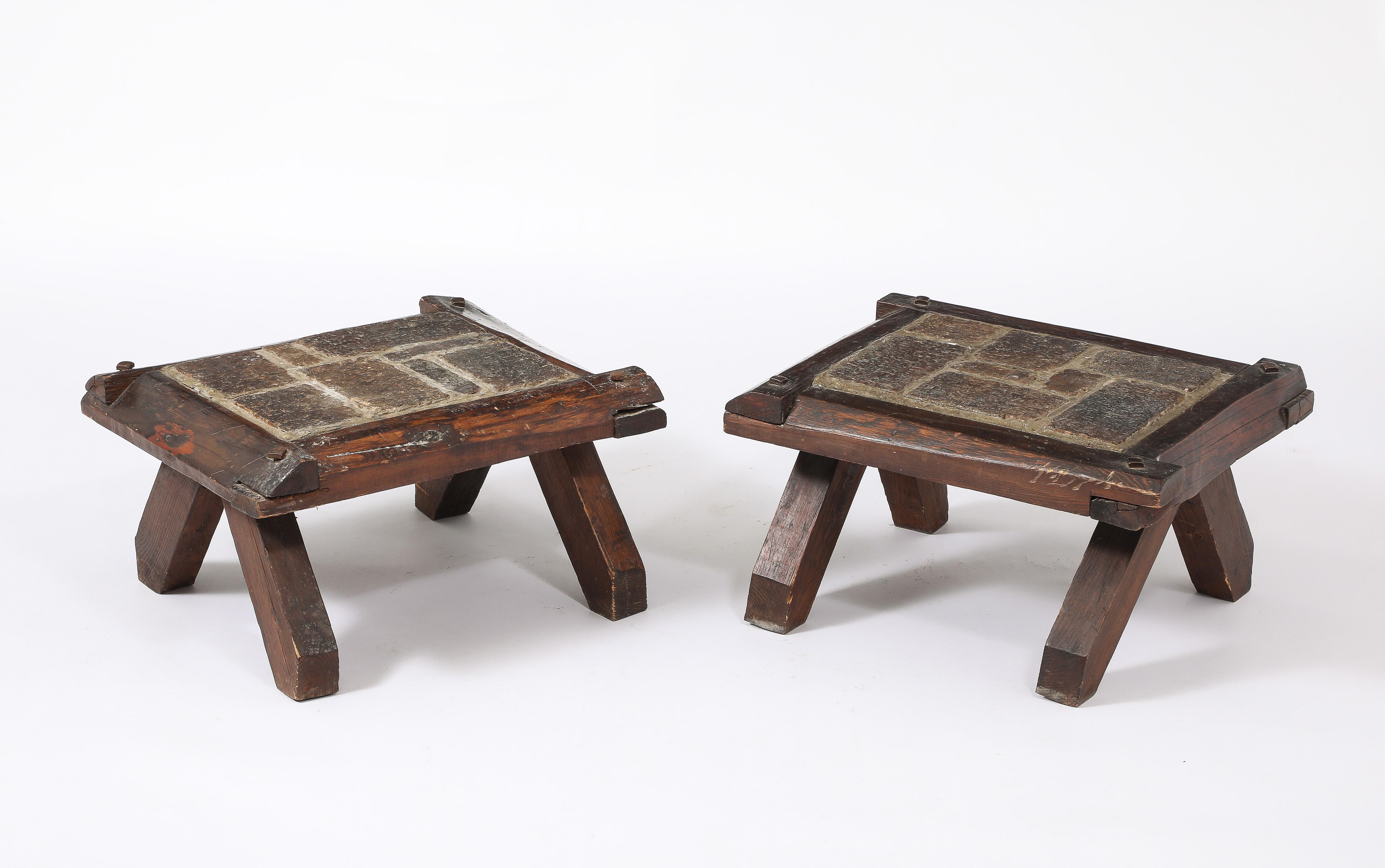 Brutalist elm tables with slate inserts.
