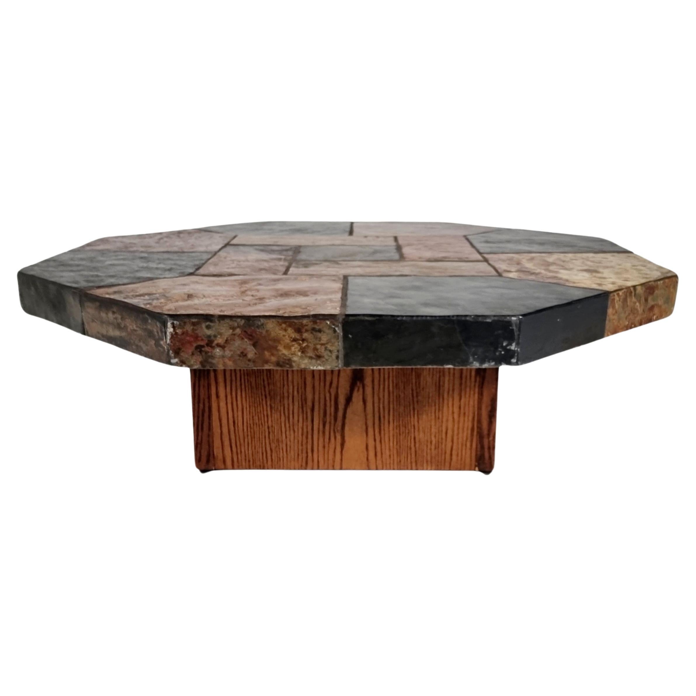 Brutalist slate stone and wood hexagonal coffee table, Belgium, 1970s

This piece is heavy, forming a rock-solid statement piece in your living room. It is composed of all kinds of differently shaped natural stone and has a beautiful color scheme.

