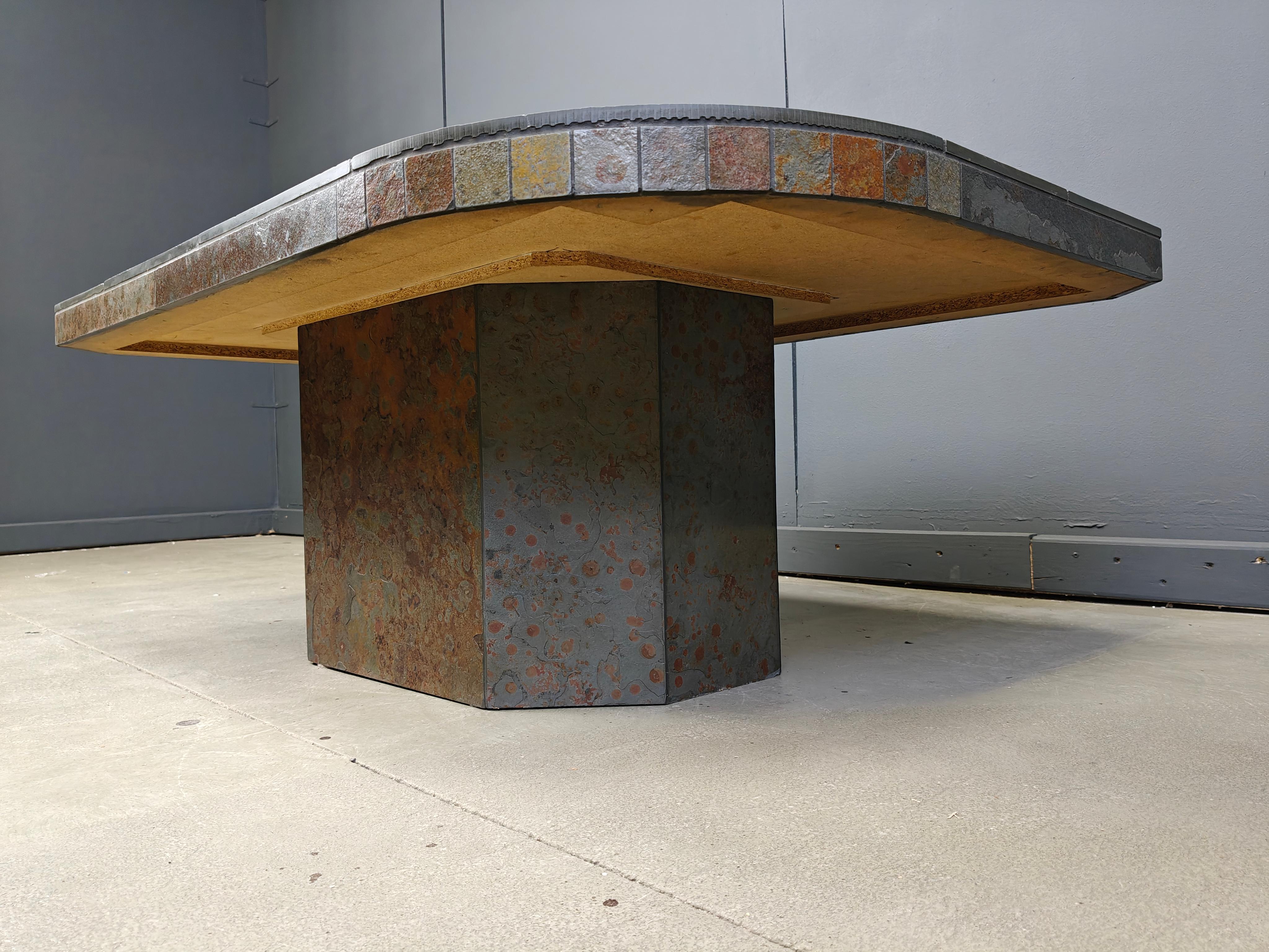 Brutalist slate and natural stone top coffee table moounted an an equally beautiful stone base.

Good condition.

1980s - Germany

Height: 40cm
Width: 120cm
Depth: 80cm

Ref.: 25090807

*All images are always part of the description, our vintage