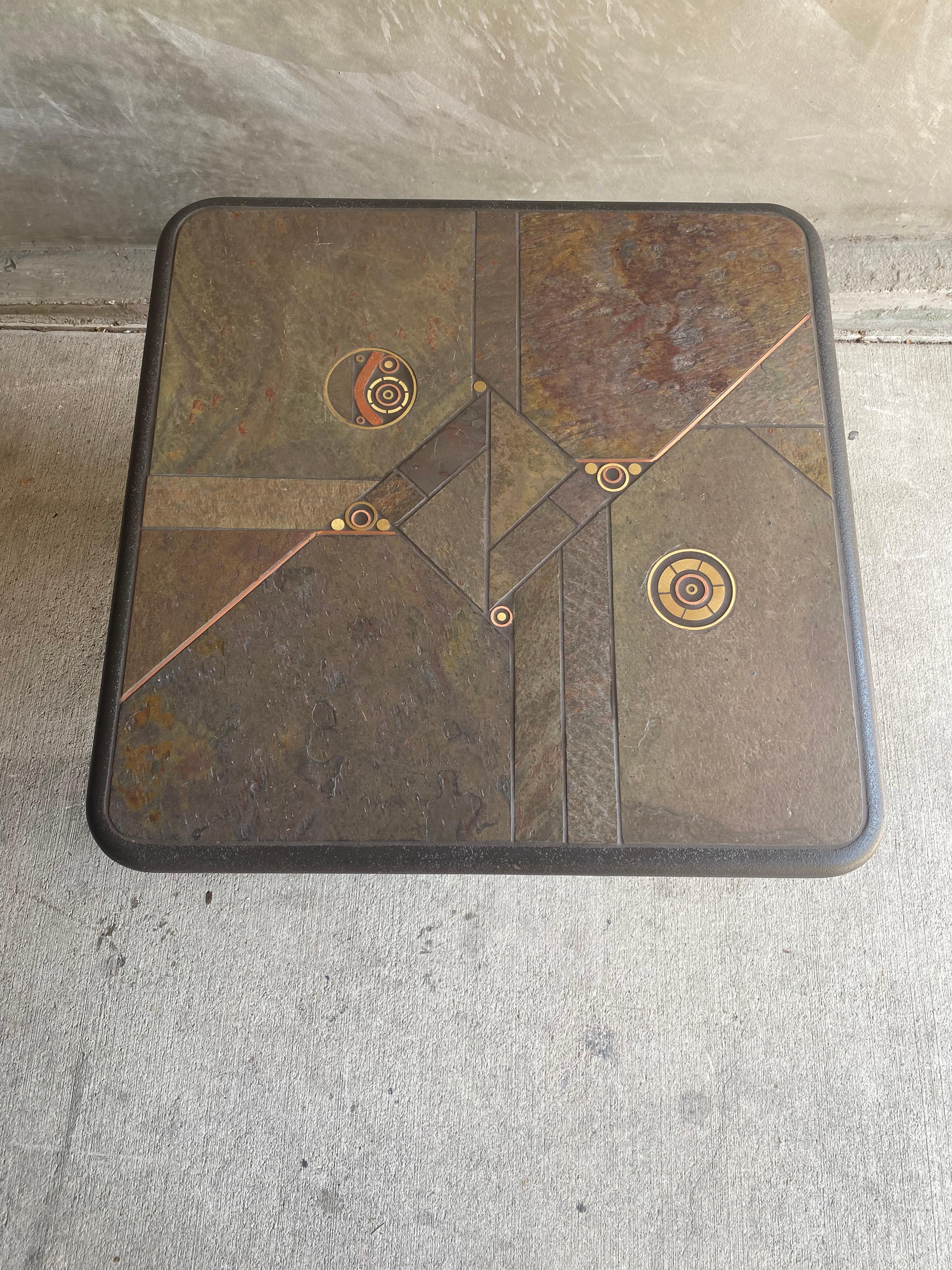 Brutalist side or cocktail table with slate style top and brass and copper inlay in asymmetric pattern.  Belgium, 1970's
