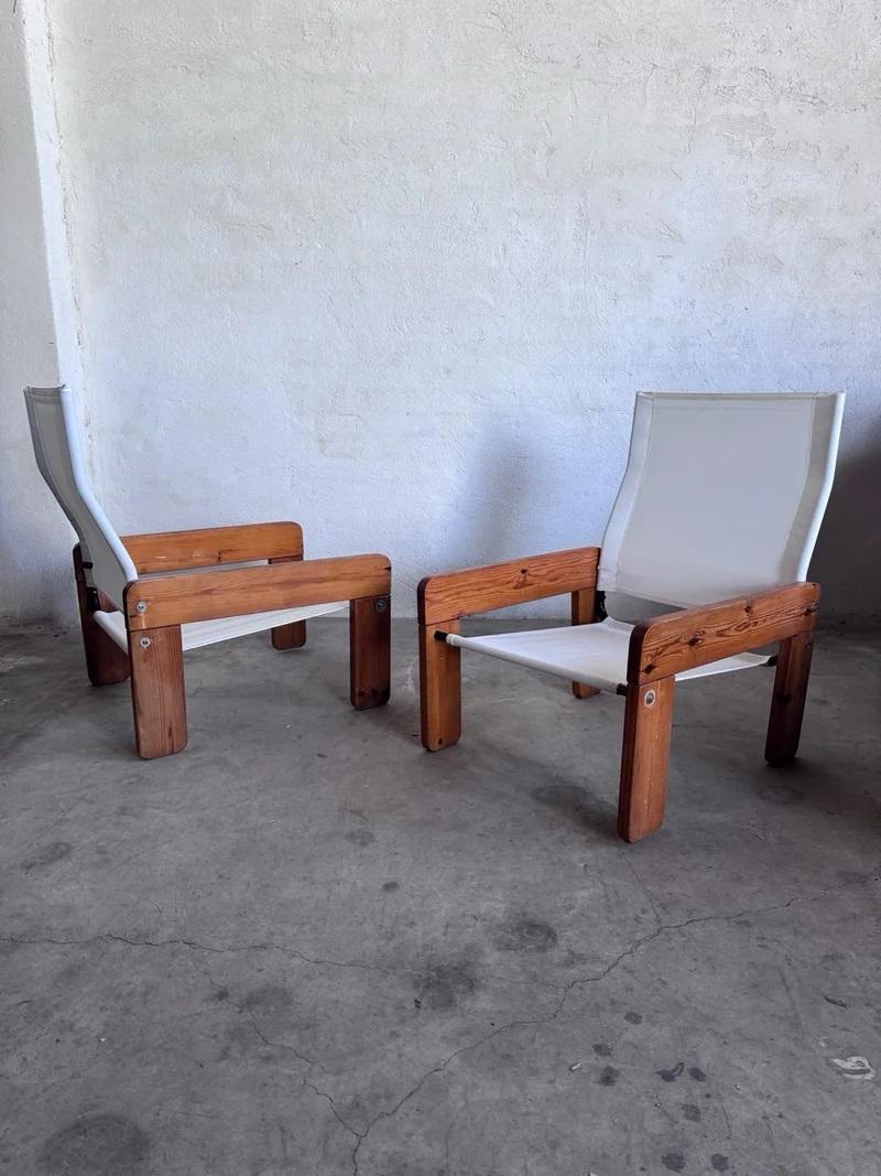 Beautiful set of 2 Brutalist Sling Fabric Lounge Chairs circa mid 1970s fabricated in solid pine wood frames and fabric 