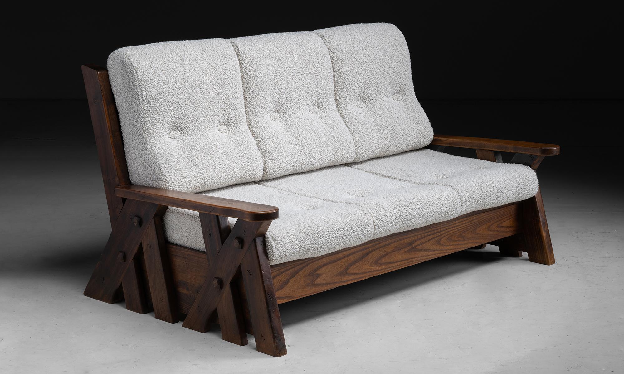 Brutalist Sofa in Boucle

France circa 1970

Frame constructed in elm. Newly upholstered in boucle with double “x” frame side supports.

Measures 69.25”L x 43”d x 38”h x 14”seat