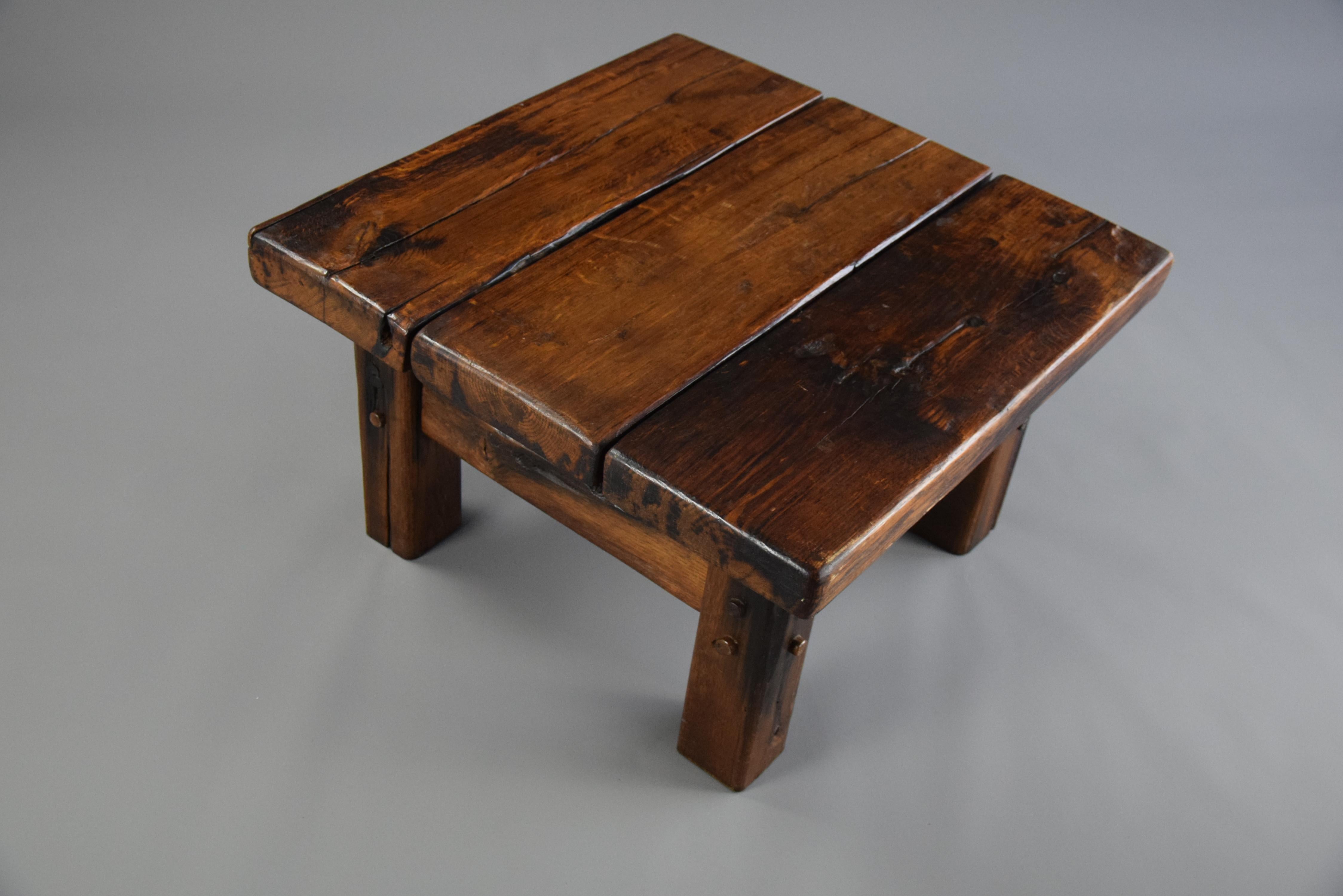 Striking robust brutalist coffee table made of solid Elm wood. The elm has warm colors and a fantastic patina from use over decades of years.

Measurements : 77 x 77 x 45cm - 30.31 x 30.31 x 17.72 inches.

This beauty will be shipped insured