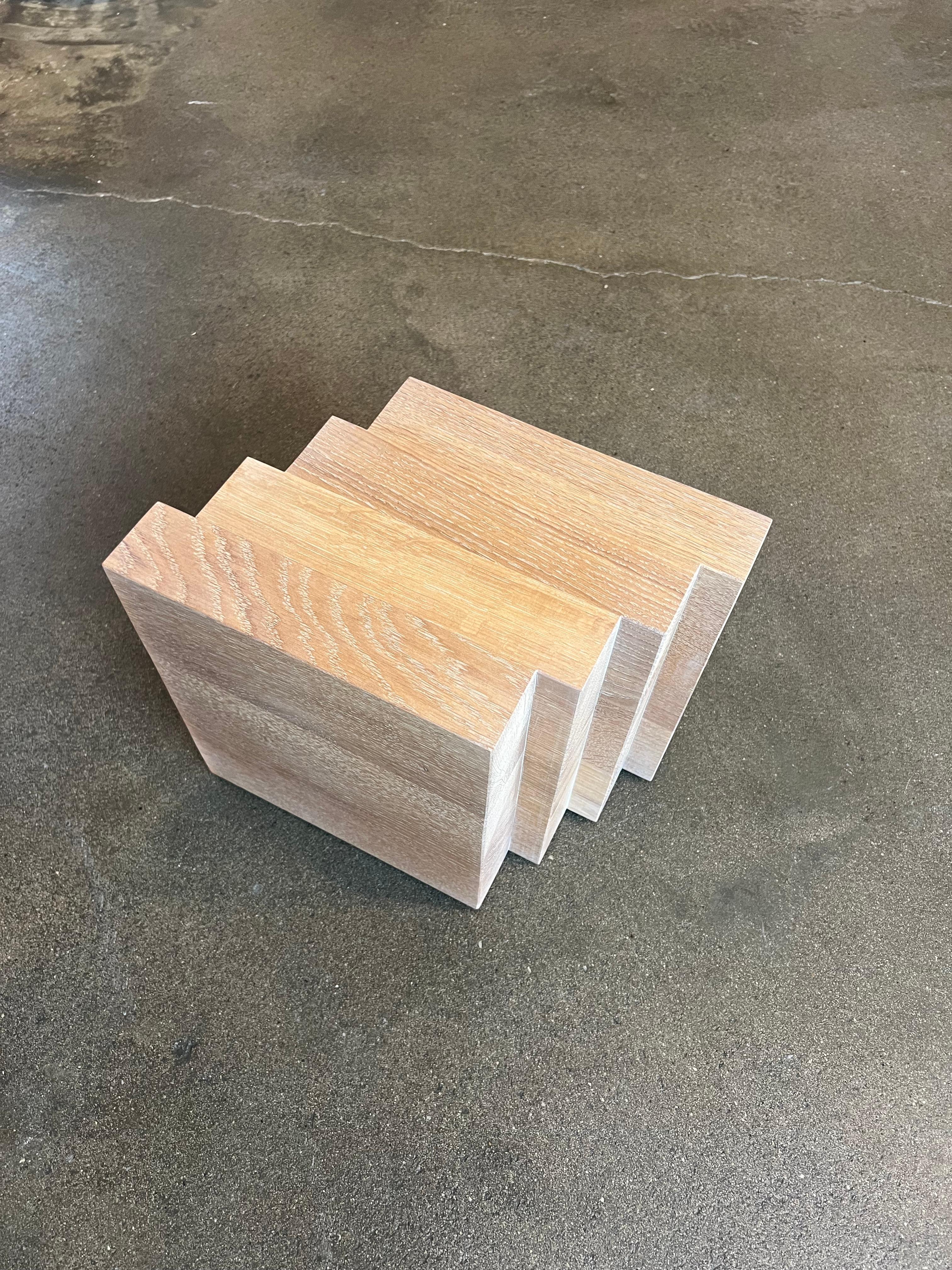 This solid oak Cadence side table is a showroom model in excellent condition. 
- Dimensions: L:34 x W:22 x H:30 cm. 
- The price includes a custom wooden shipping crate. 
- The thick solid wooden beams may contain small knots and cracks; these