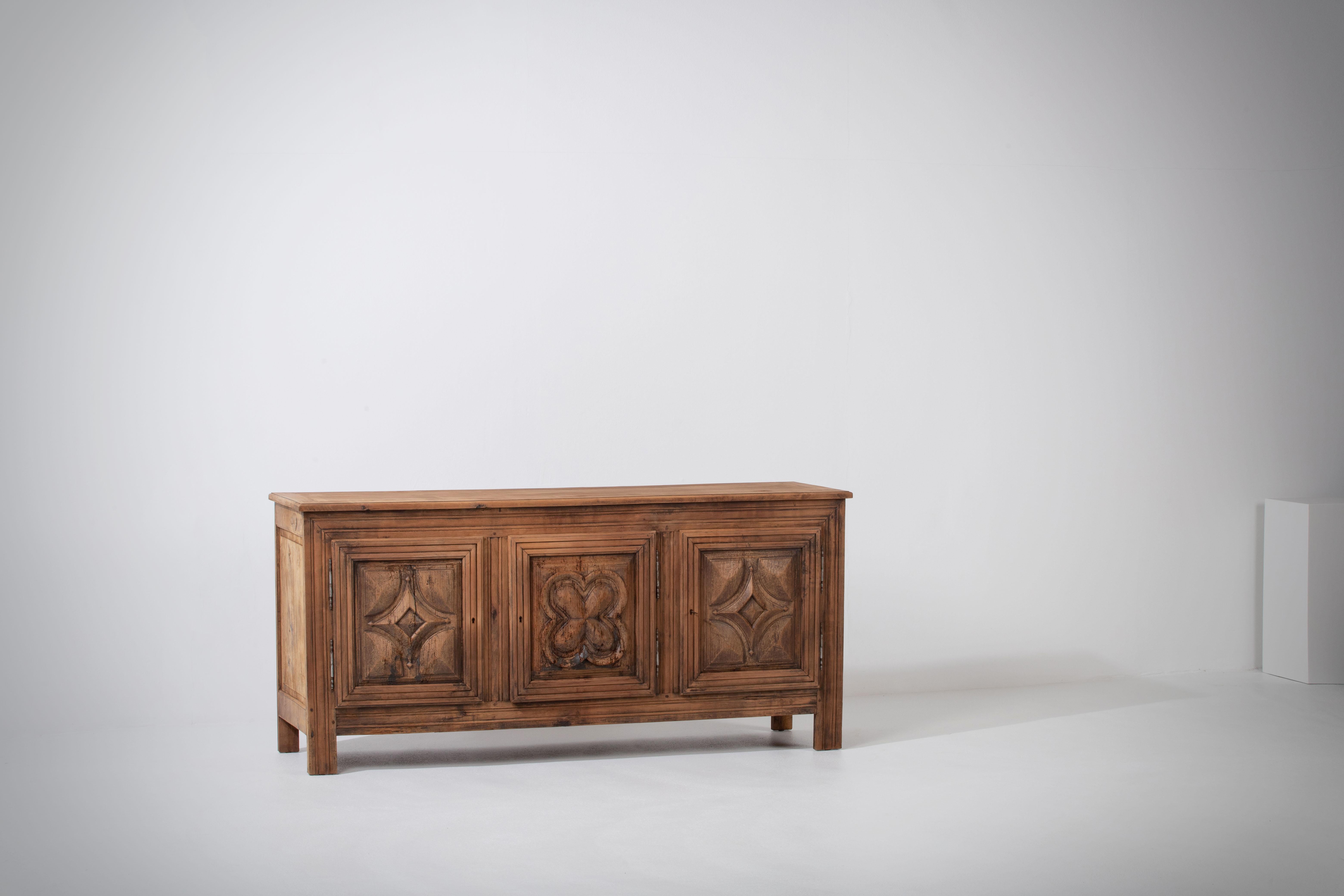 Introducing an exquisite sideboard crafted from mahogany in France during the 1900s. This remarkable piece showcases the timeless beauty and craftsmanship of the era.

In its original condition, this sideboard boasts a beautiful patina that
