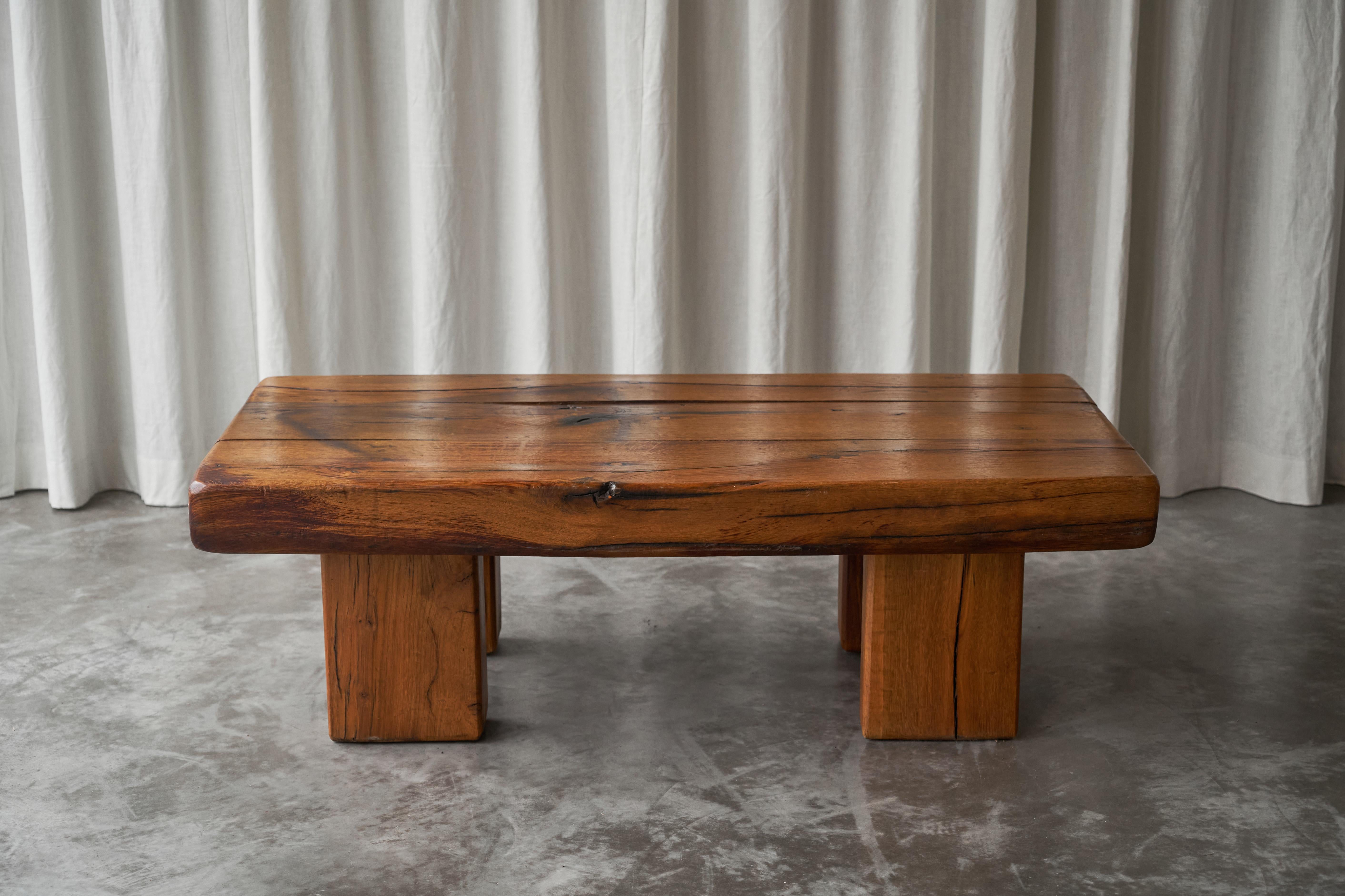 Brutalist Solid Oak Beam Coffee Table, Europe, 1970s.

This monumental Brutalist solid oak beam coffee table was made in the 1970s, in Europe. It has a modest yet a very strong appearance, free of any decoration. The rectangular legs are placed