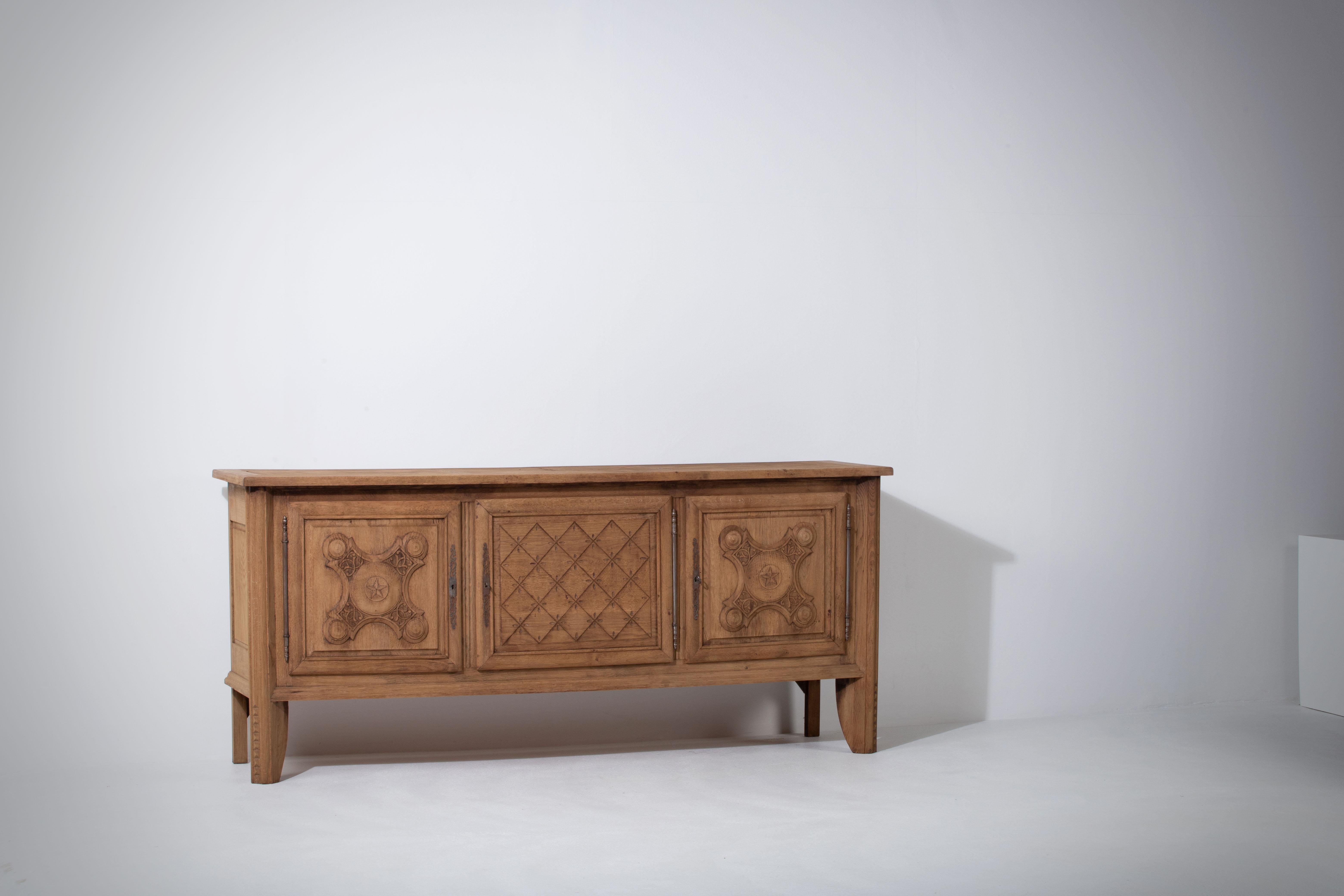 A matching sideboard is available.
Brutalist solid Elm sideboard, credenza.
The buffet features stunning oak structure on door panels. It offers ample storage, with shelve behind the doors. 
A unique blend of Art Deco Spanish and Brutalist Modern