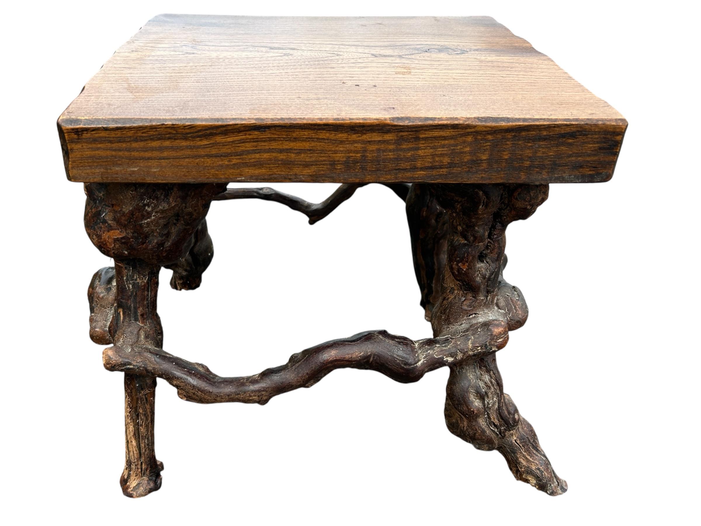 French brutalist solid wood and vine base table For Sale
