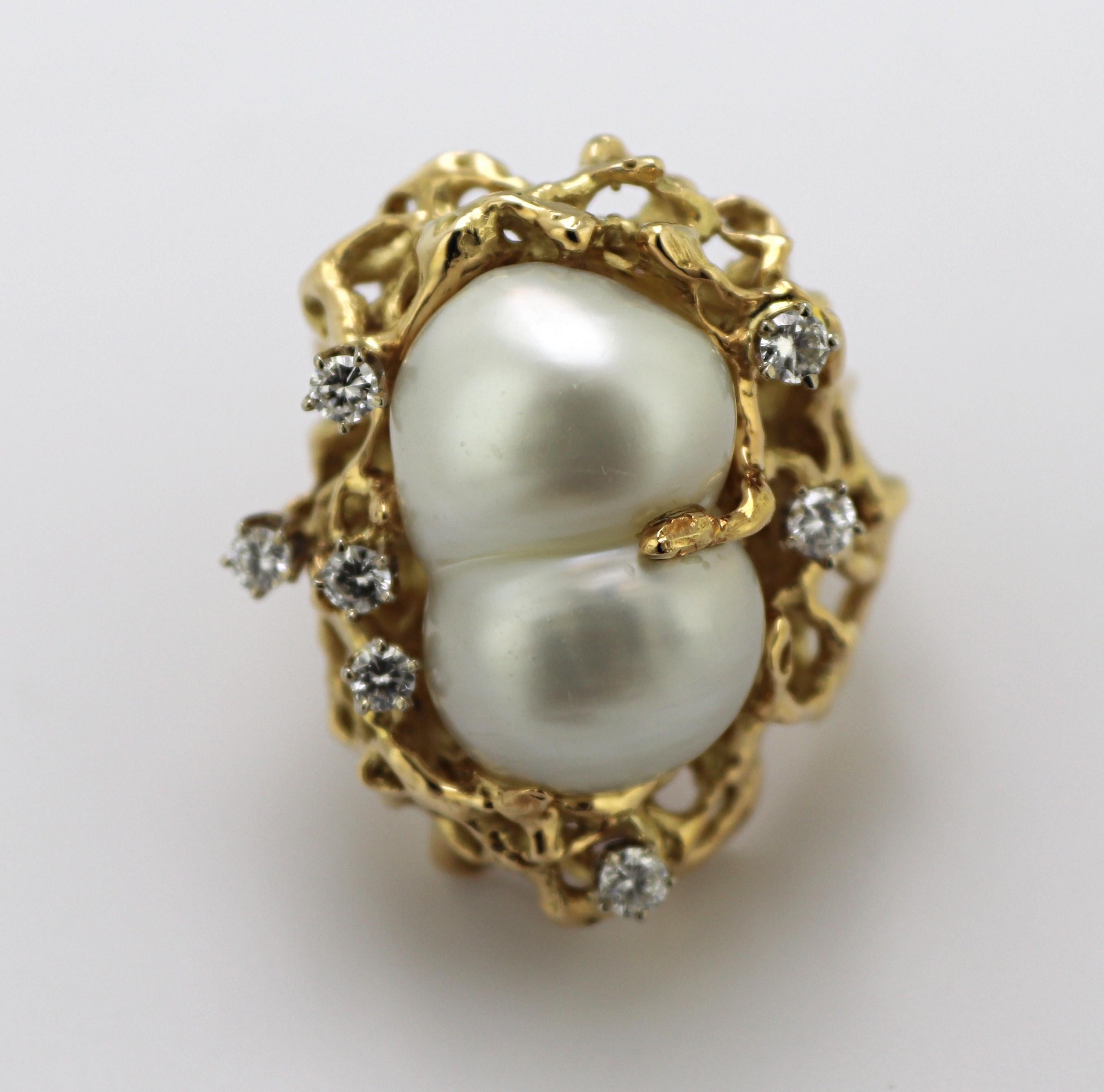 Featuring one baroque double South Sea cultured pearl, 20 X 12.5 mm,
accented by (7) full-cut diamonds, 0.50 ct. tw., SI, I-J, set in a free forms
naturalistic brutalist mounting 28.6 X 23.6 X 7.9 mm, size 7, Gross Weight
21.8 grams.