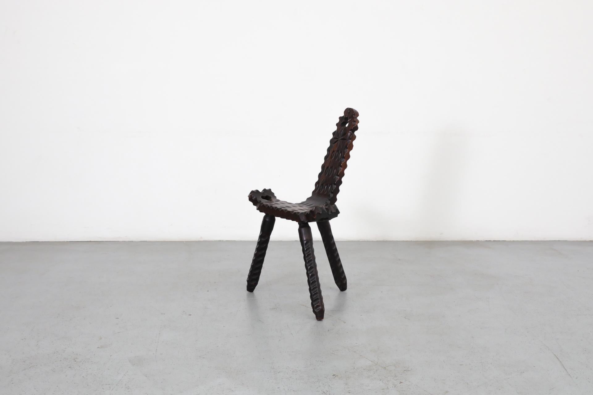 Carved Brutalist Spanish Fireside Chair with Tripod Legs and Decorative Carving