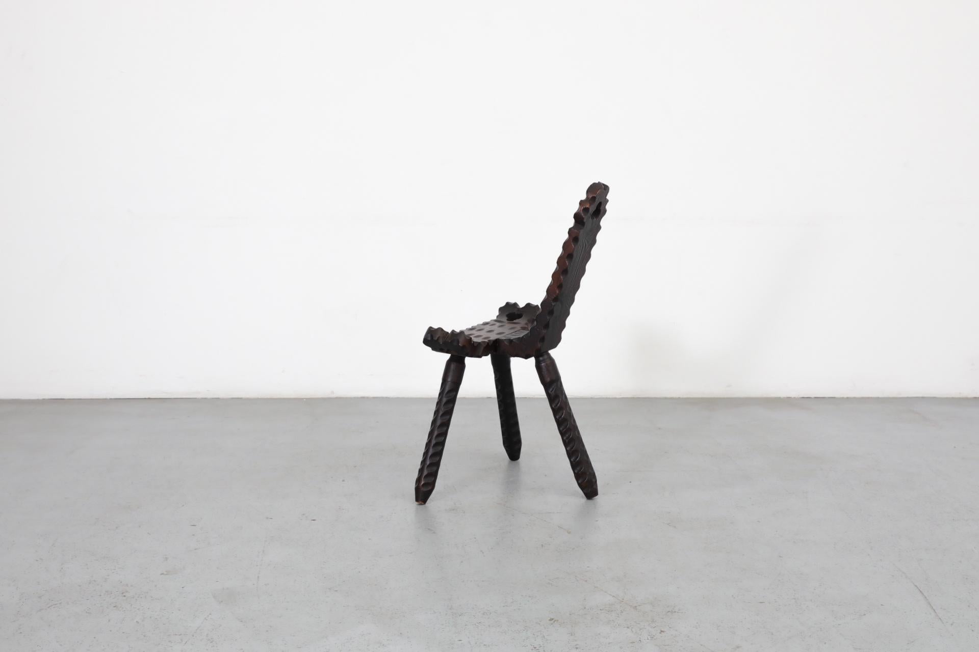20th Century Brutalist Spanish Fireside Chair with Tripod Legs and Decorative Carving