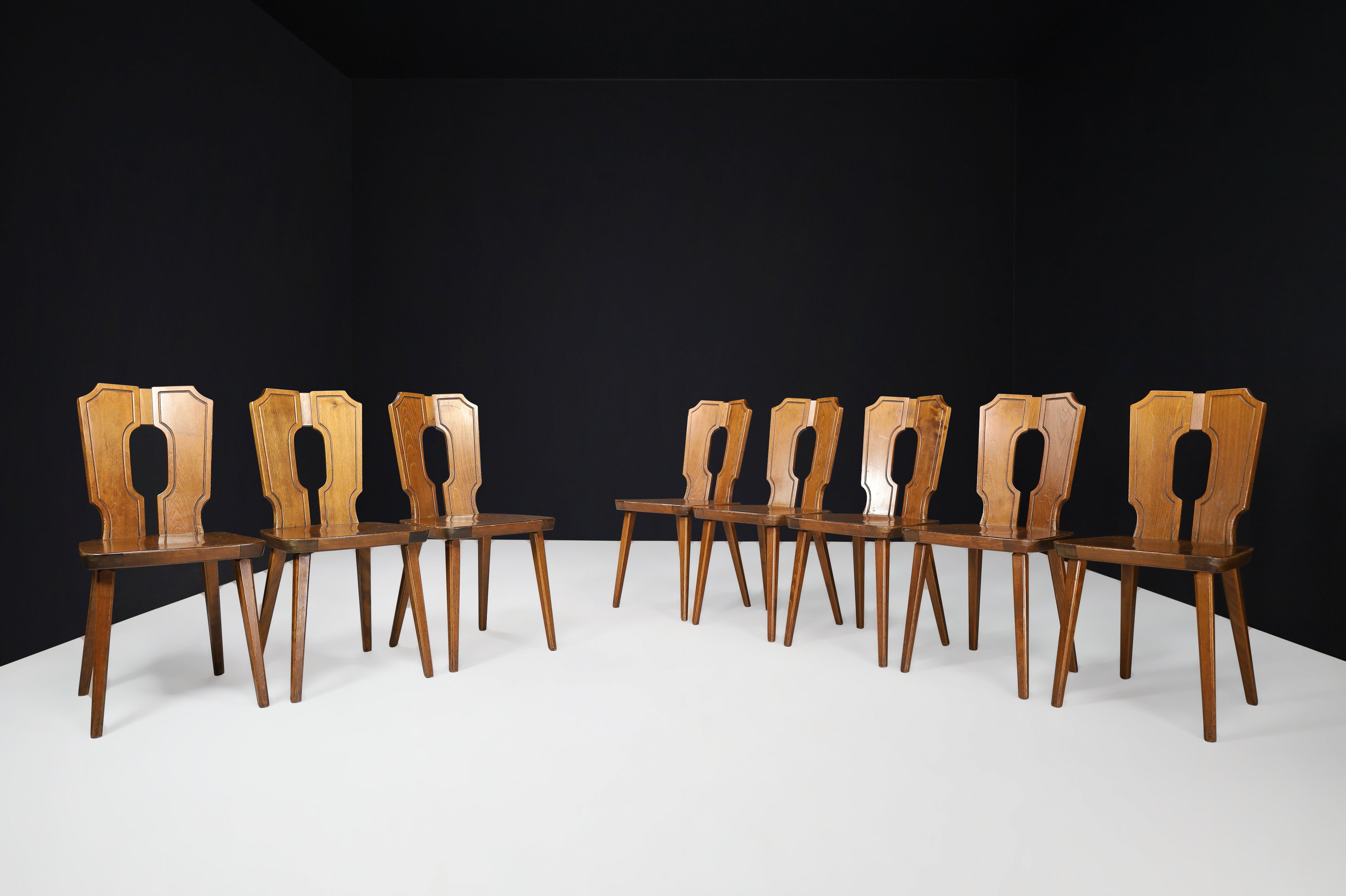 Brutalist stained beech dining chairs, France 1960s

Brutalist, stained beech dining chairs with octagonal tapered legs, curved in the back, France 1960s. These chairs are made entirely of wood. They are in excellent original condition. No defects,