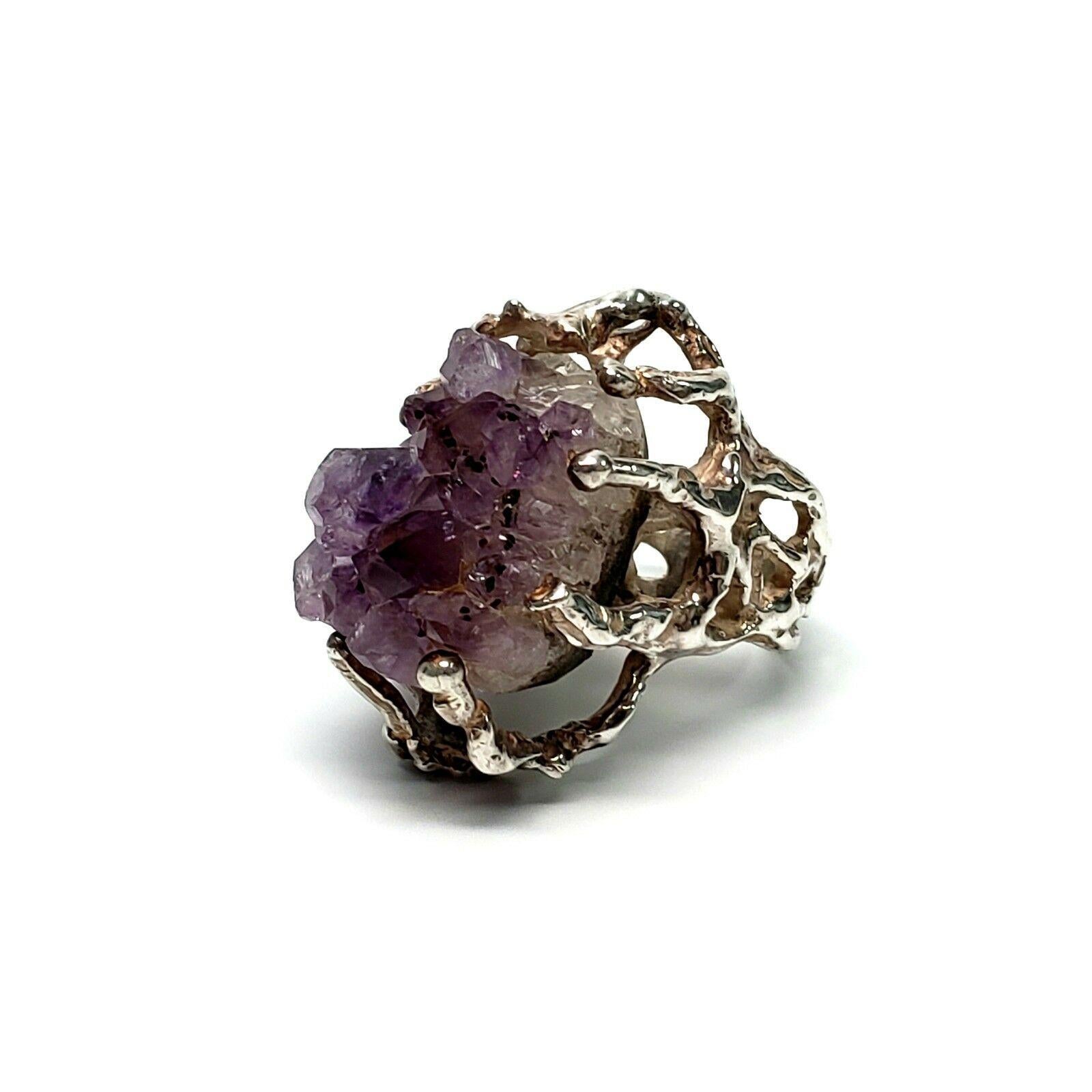 Brutalist Sterling Silver Raw Amethyst Ring, Size 7 1/4.

This is a unique piece, featuring a large raw amethyst in a long-pronged setting.

Measurement:  Front of ring measures approx. 1 1/4