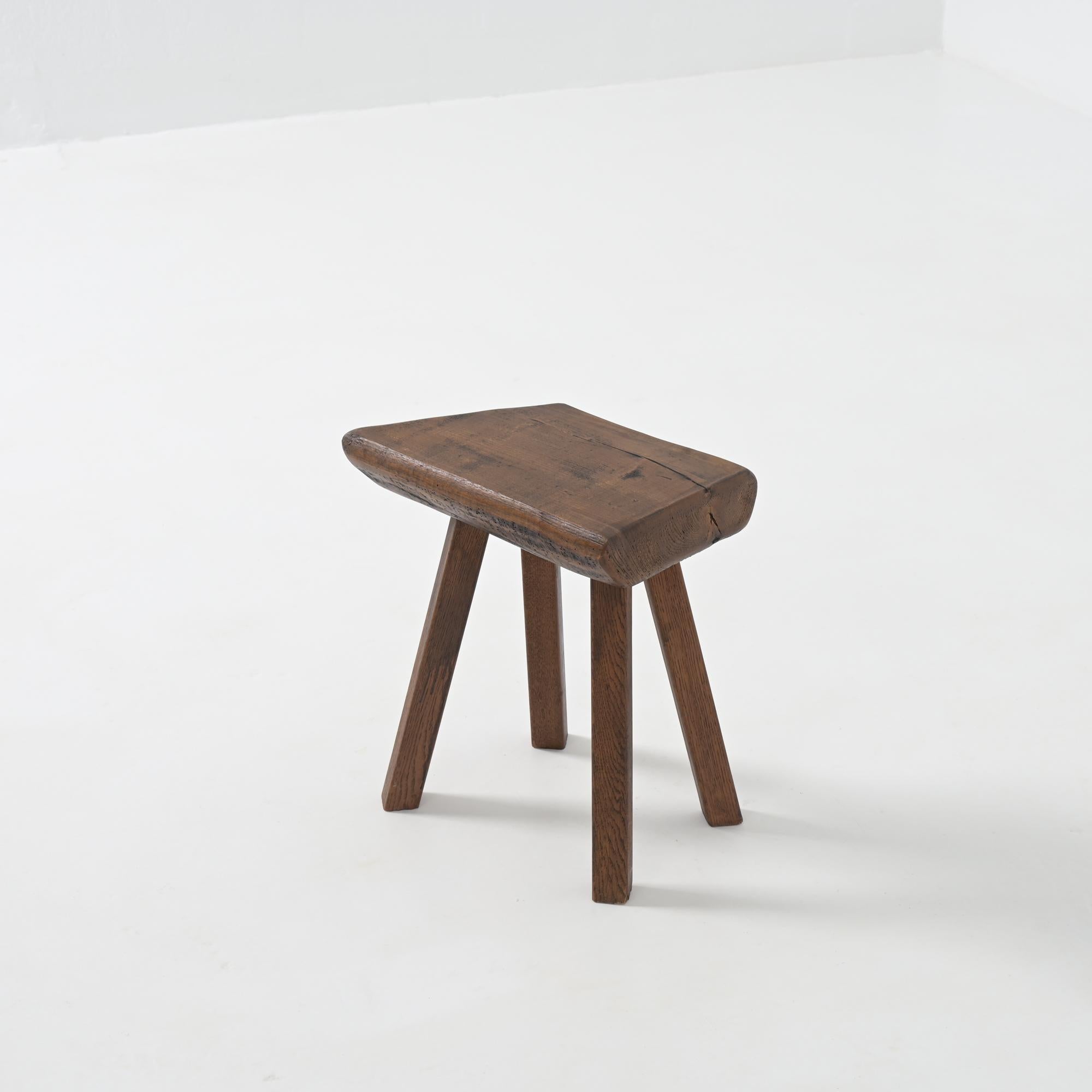 This strong robust stool is handcrafted from dark-colored oak wood. It will bring a natural, bucolic feel to your interior.
This brutalist stool is in very good condition, showing normal signs of age and use. It dates from the 1950s.
It was made in