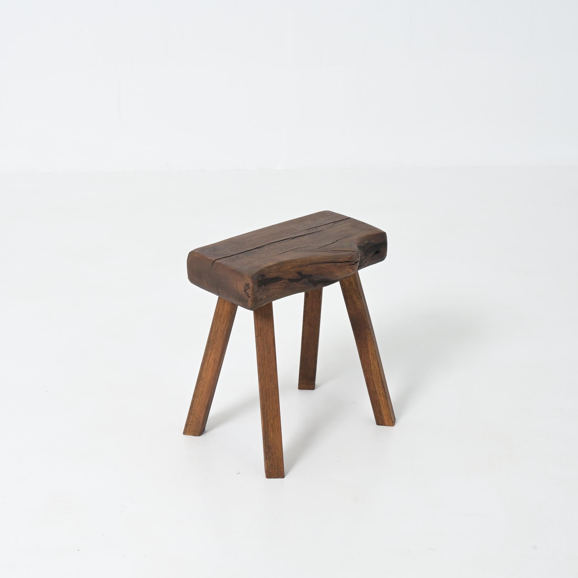 This strong robust stool is handcrafted from dark-colored oak wood. It will bring a natural, bucolic feel to your interior.
This brutalist stool is in very good condition, showing normal signs of age and use. It dates from the 1950s.
It was made in