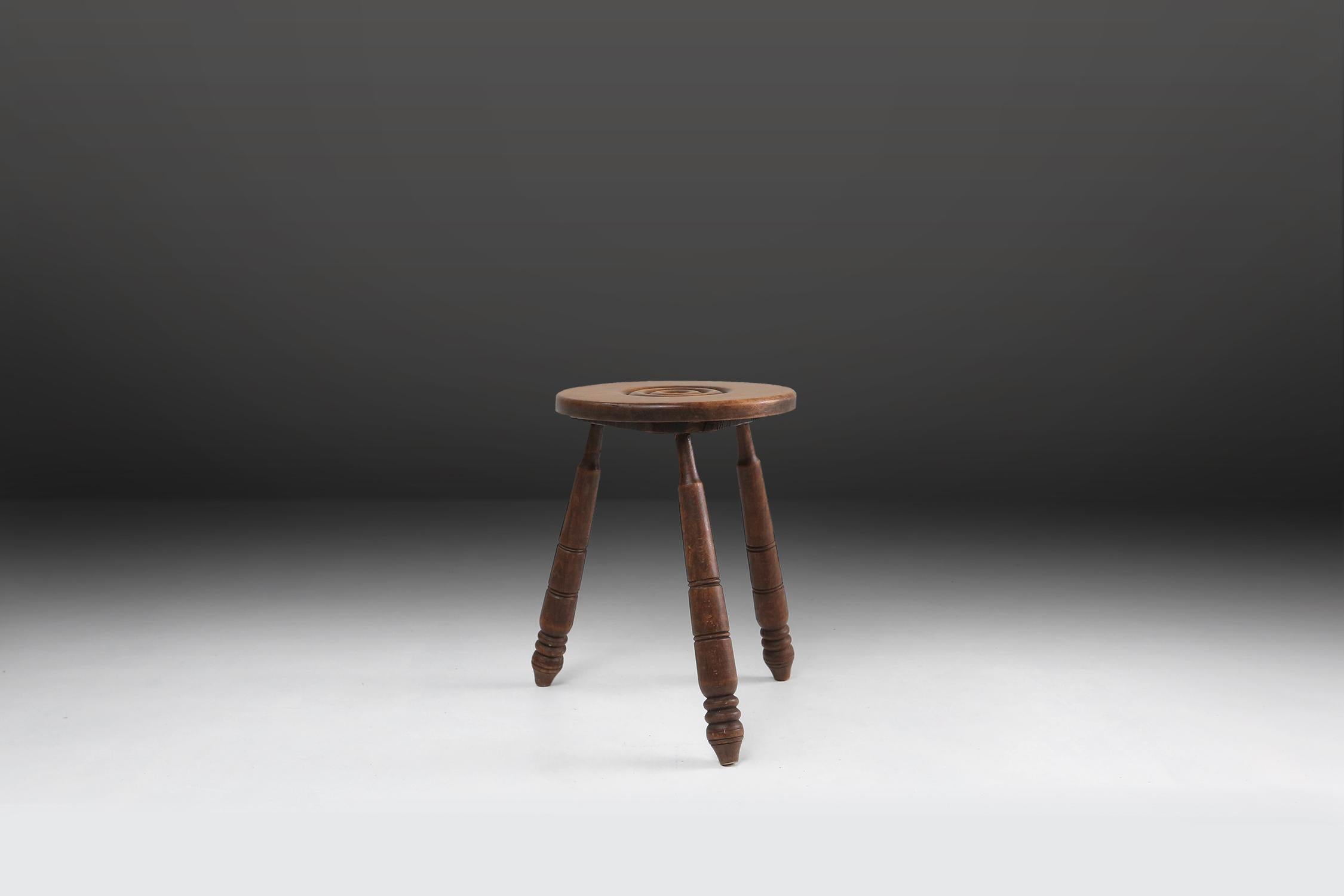 Brutalist stool made of solid wood with some nice patina on the wood.