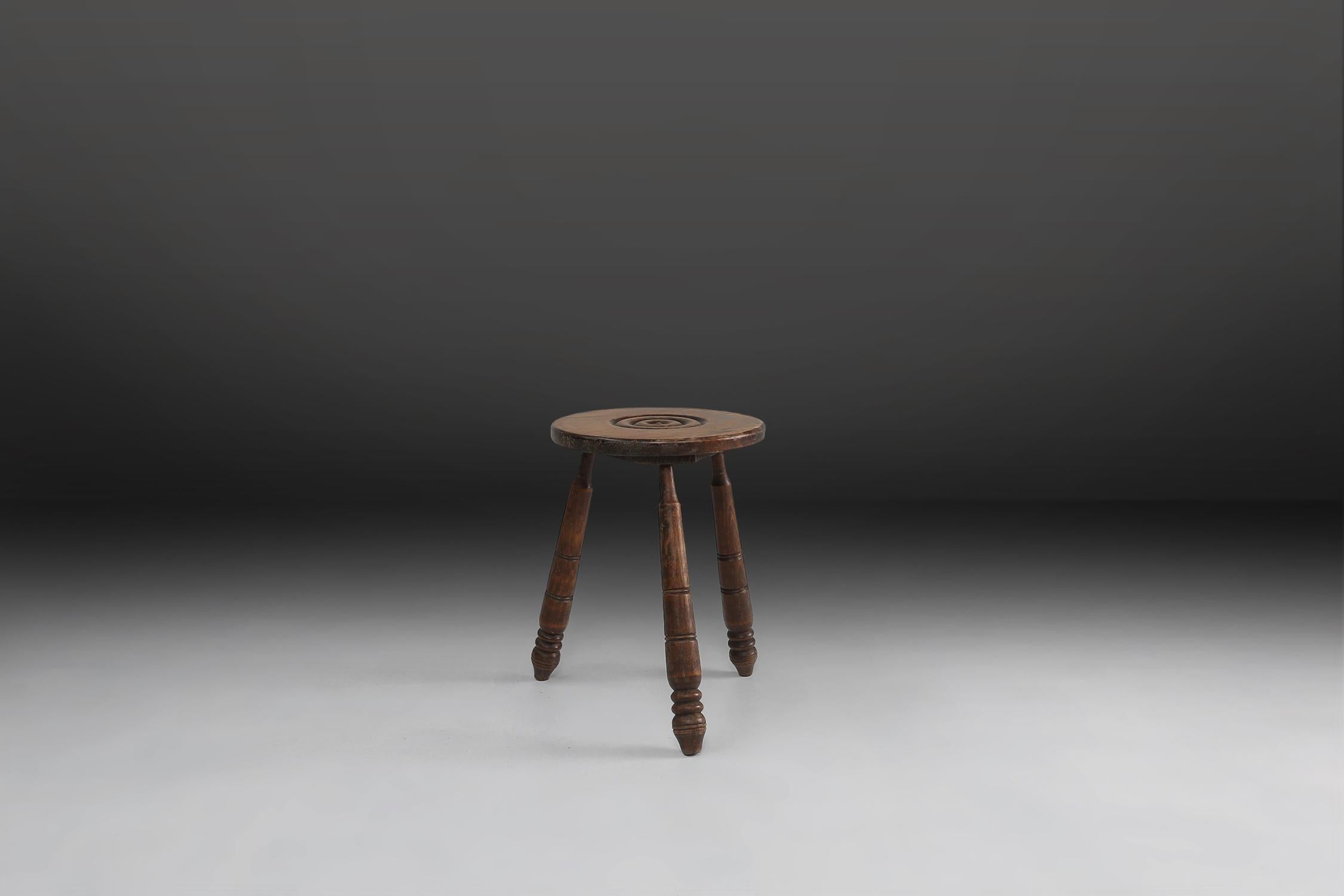 Brutalist stool made of solid wood with some nice patina on the wood.