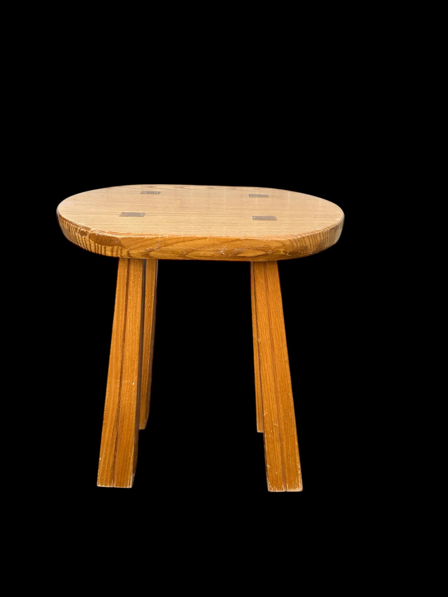 brutalist stool from the 1970's with square carved legs , in the manner of Chapo 