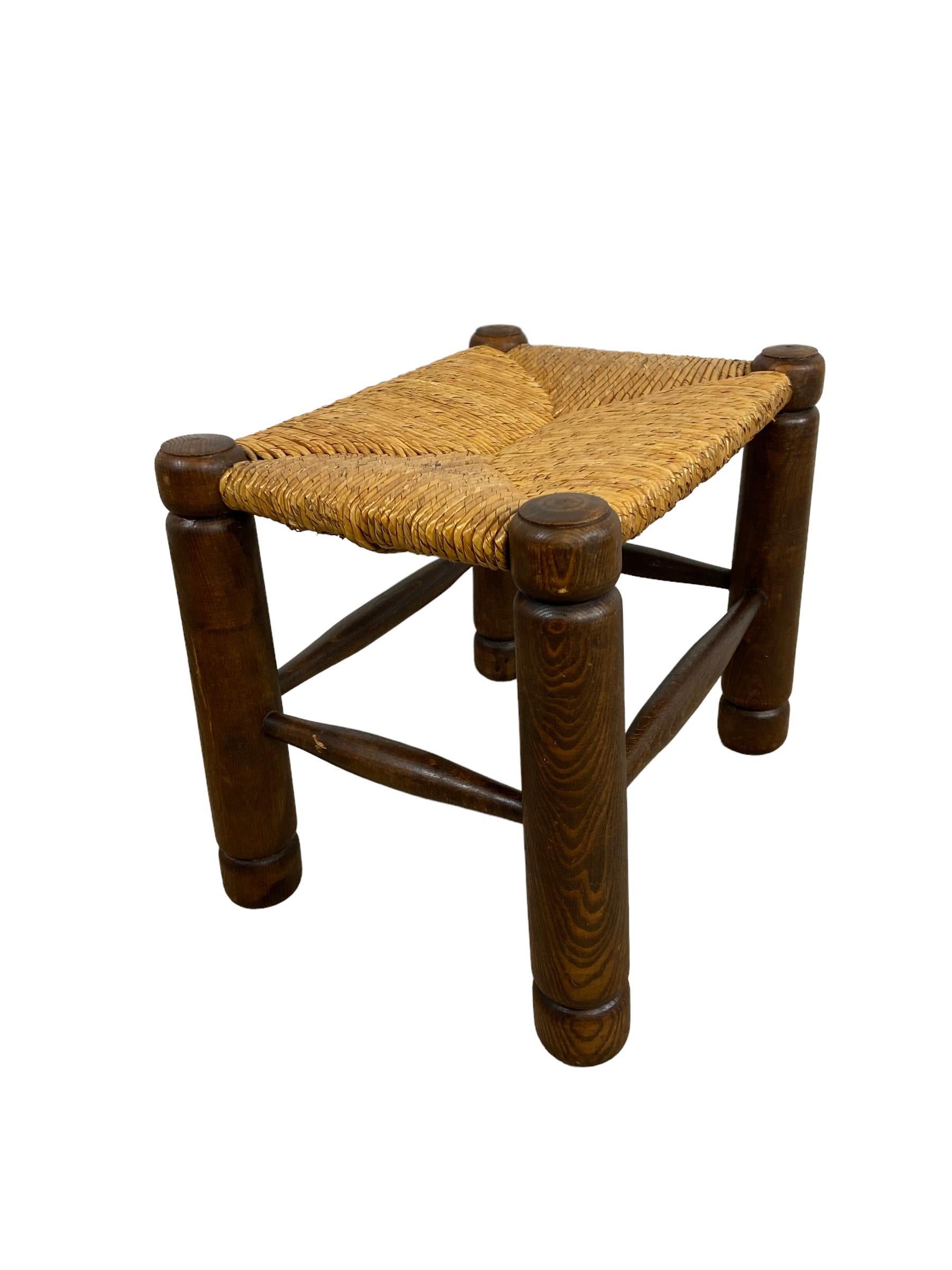 Brutalist stool made of oak, with a rush seat. Made in The Netherlands in the 1960s. This vintage object is in a good condition but it shows sign of age.