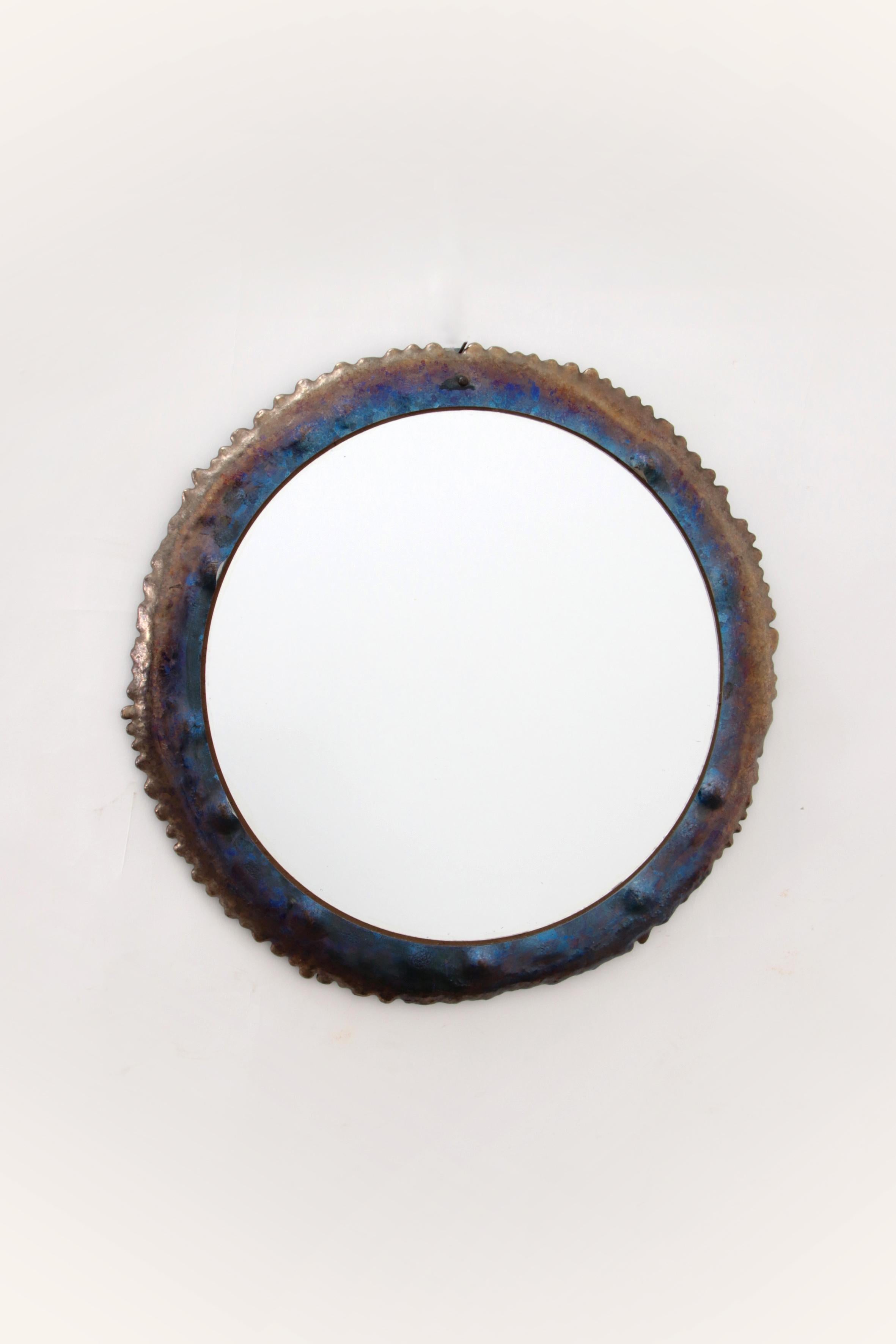 Brutalist tough Wall mirror with enamel on metal 1970s


This is a rare mirror with a very nice brutalist look. Made of metal with glaze over it, which gives a blue glow to the metal.

This mirror comes from Italy and was made in the 1970s.