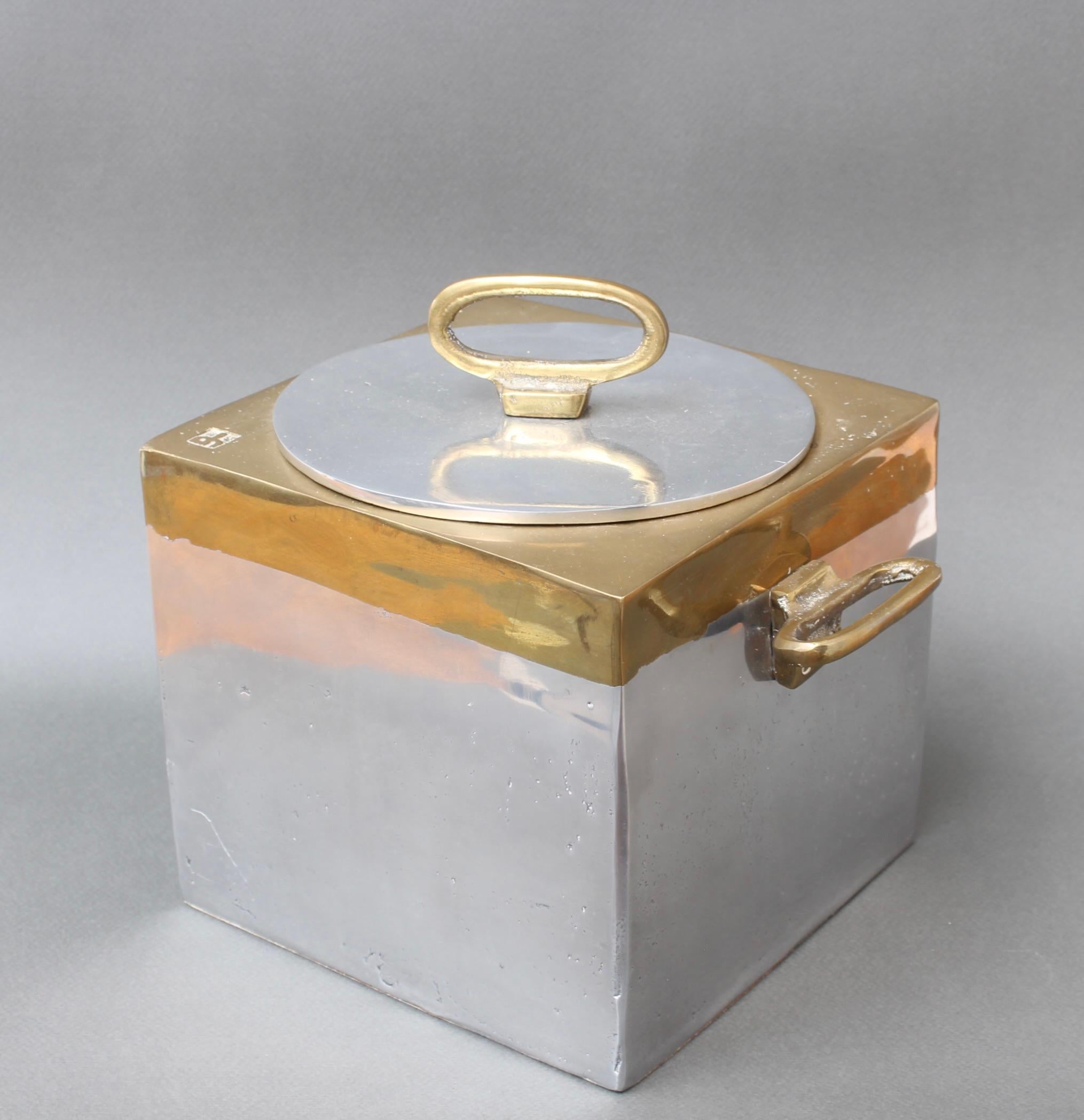 Aluminium and brass brutalist style ice bucket by David Marshall (circa 1980s). A stunning piece, its solidity and heft are reassuring and its tactility, sensuous. The maker's mark is impressed on one of the top corners of the brass top. The