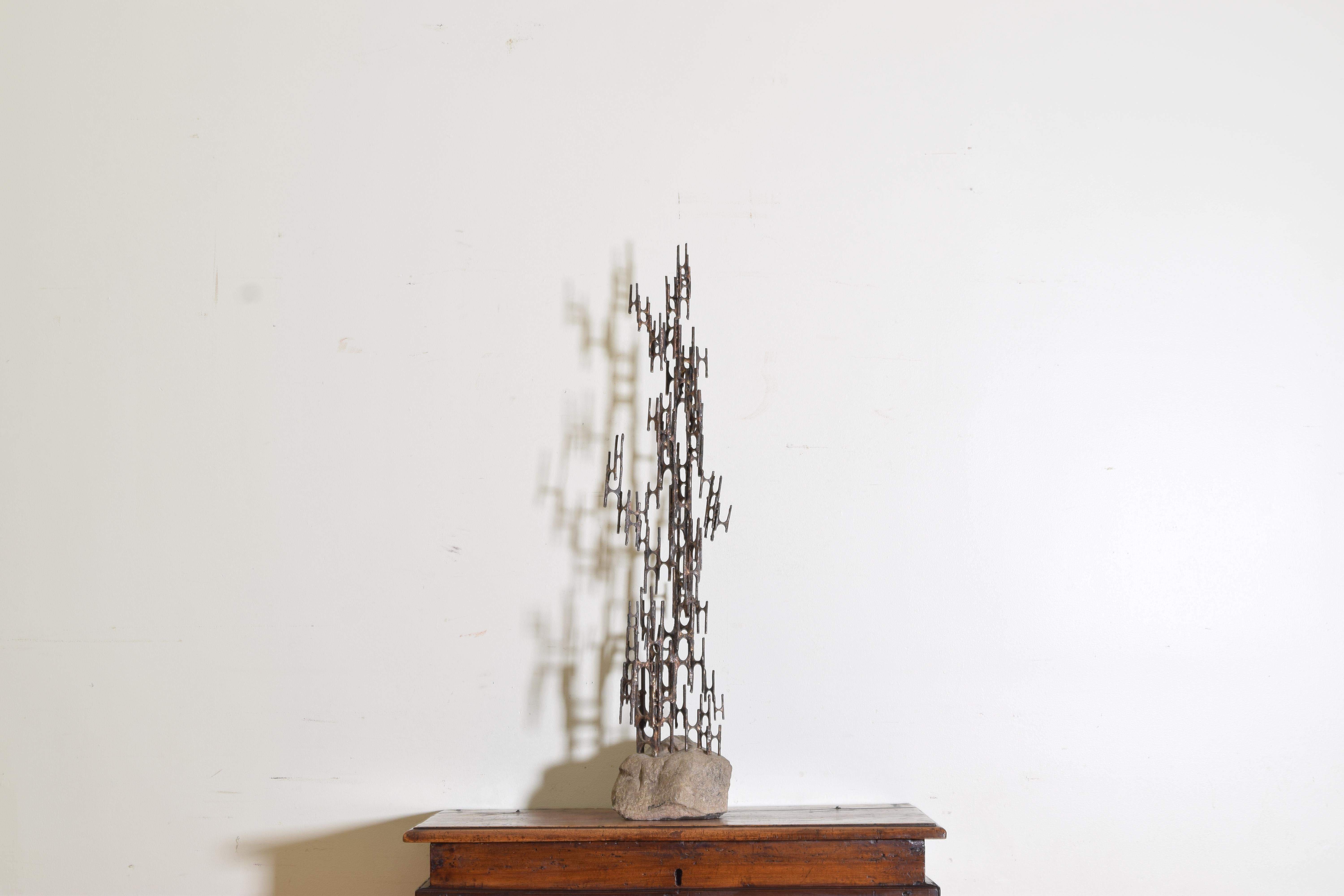 A shifting lattice work of gilt painted bronze elements welded together and rising upward from a stone base, signed P. Marshall 73'.
 
 